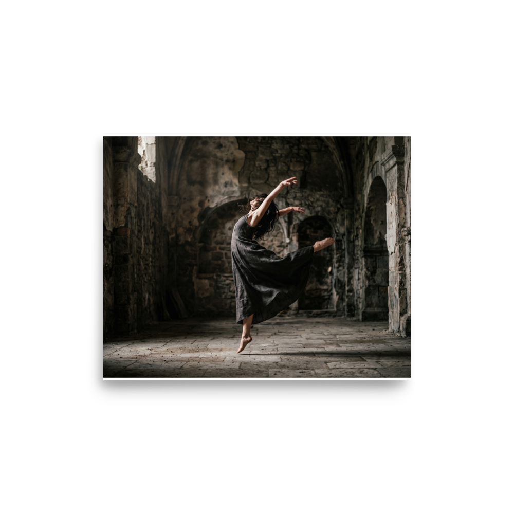 'Grace in the Ruins' — a Art photography print. A photograph of a dancer leaping gracefully in a dark flowing dress inside a ruined stone building, bringing a sense of movement to a Living Room or Studio.