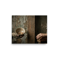 'The Divide' — a Art photography print. Conceptual photograph showing a hand in a tattered glove holding a cracked bowl with coins on the left, separated by a wooden pillar from an elegant hand resting on books with a silver candelabra on the right, fitting for a thoughtful office or library.