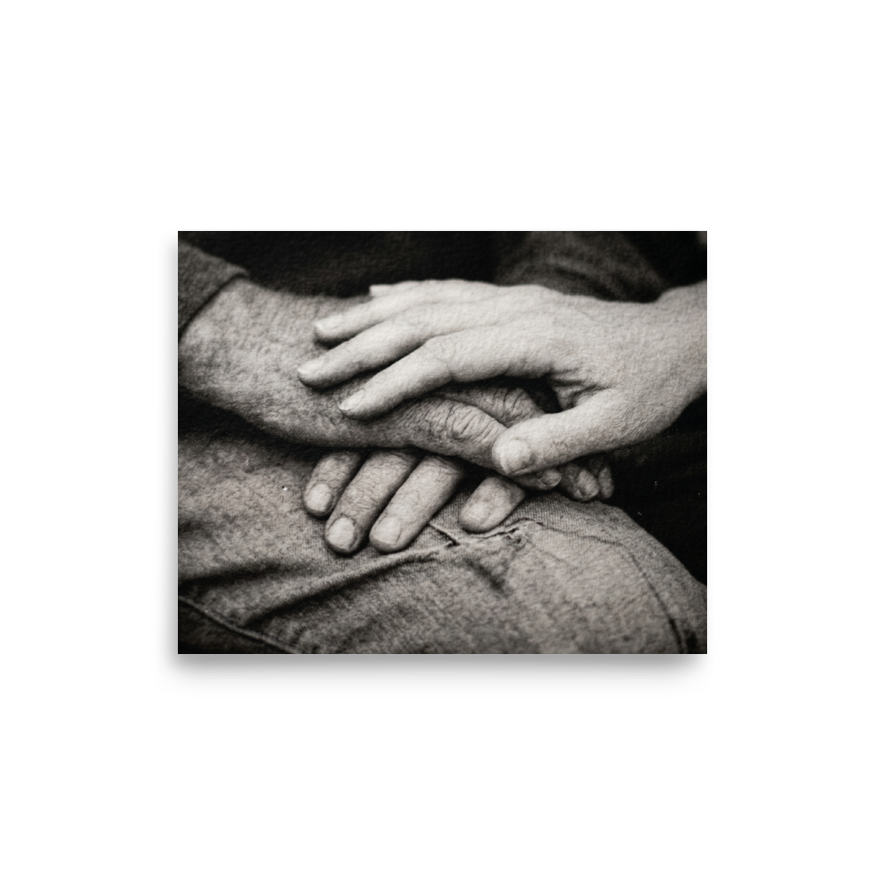 'A Lasting Touch' — a Art photography print. A black and white close up photograph of two older hands gently intertwined on a person's lap, perfect for adding warmth to a bedroom.