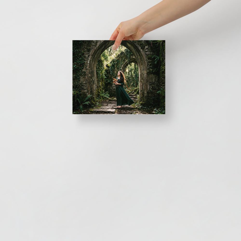 'The Forest Guardian' — a Art photography print. A photograph of a woman in a green dress standing barefoot under ruined stone arches in a forest, bringing a touch of fantasy and nature to a Bedroom.