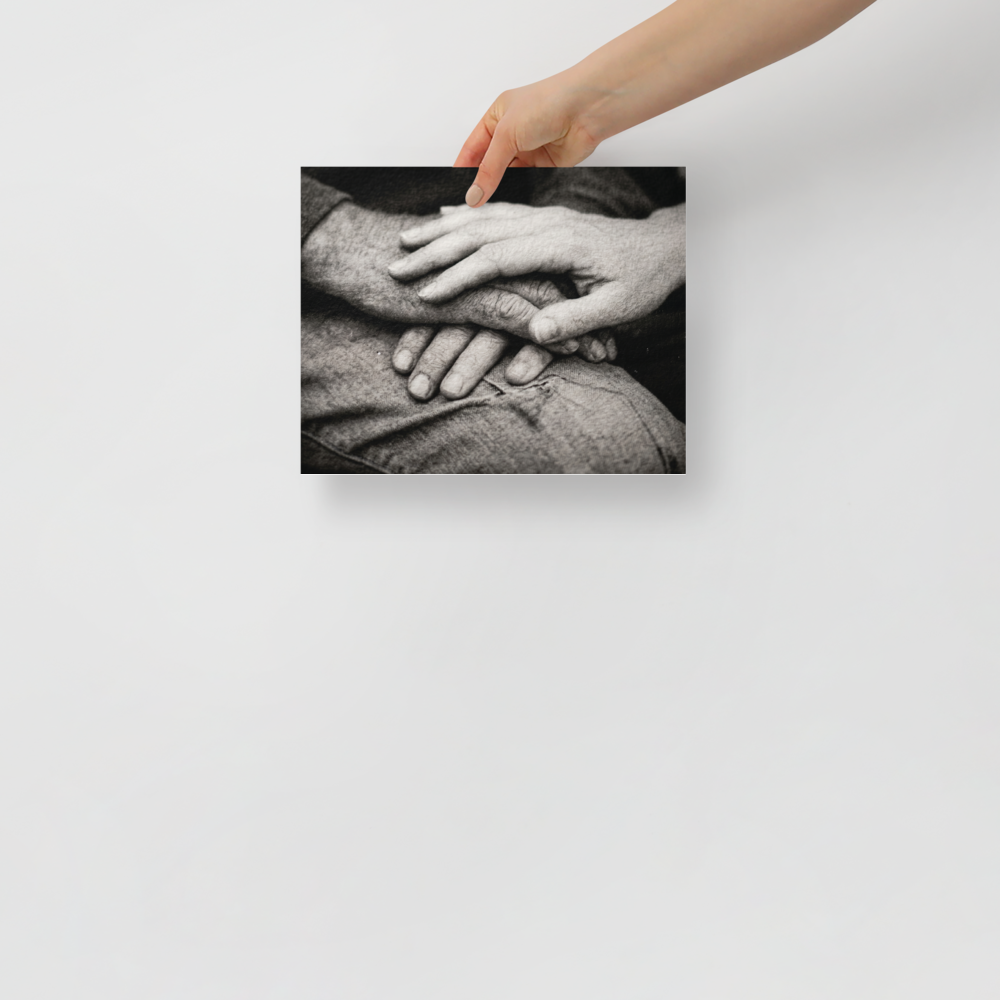 'A Lasting Touch' — a Art photography print. A black and white close up photograph of two older hands gently intertwined on a person's lap, perfect for adding warmth to a bedroom.