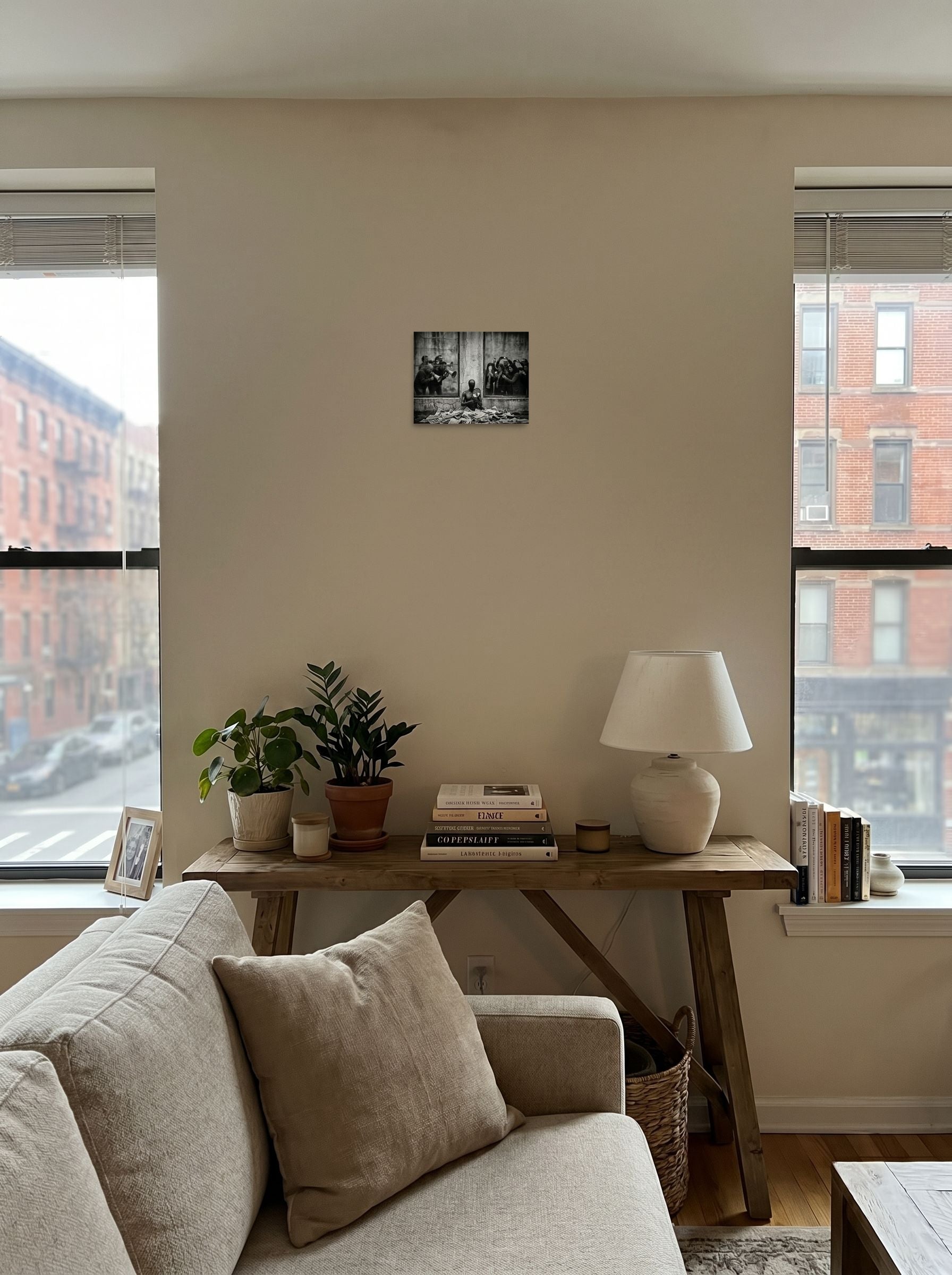 A 10x8 inch unframed paper Surrealism print of 'The Spectacle' displayed in the center of a living room.