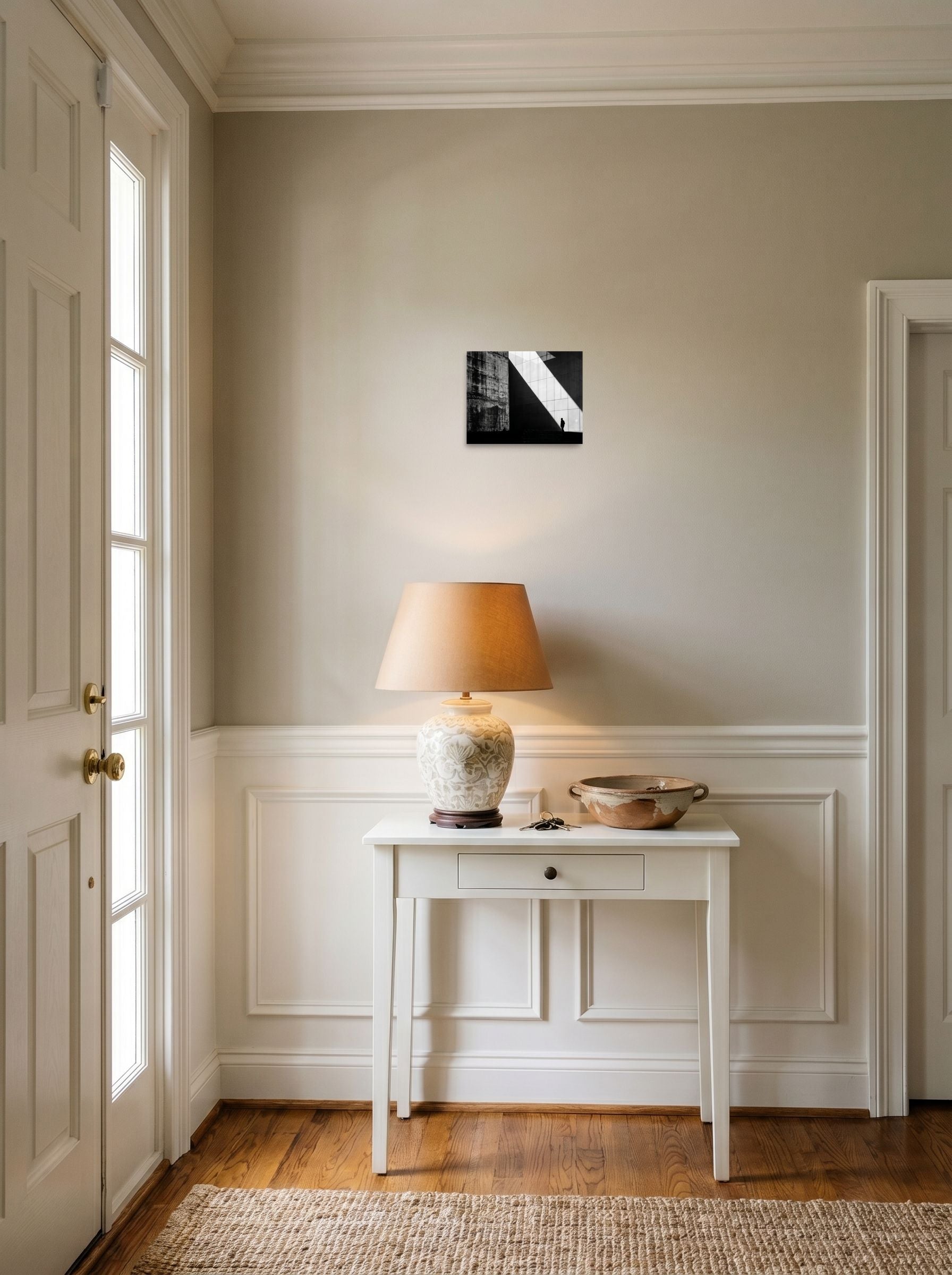 A 10x8 inch unframed paper Modernism print of 'Urban Geometry' hanging in an entryway near a console.