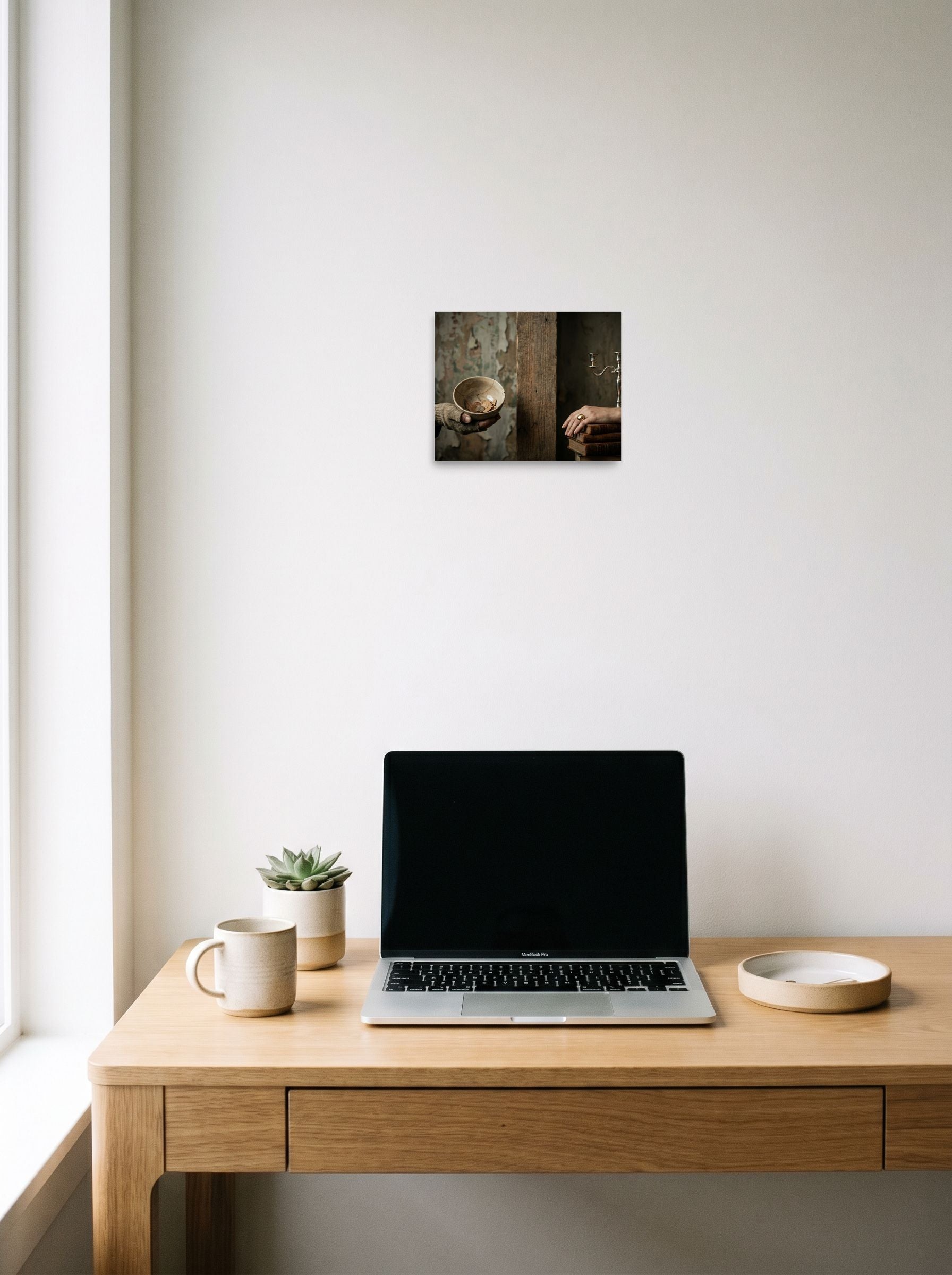 A 10x8 inch unframed paper Art photography print of 'The Divide' hanging above a worktable with a laptop.