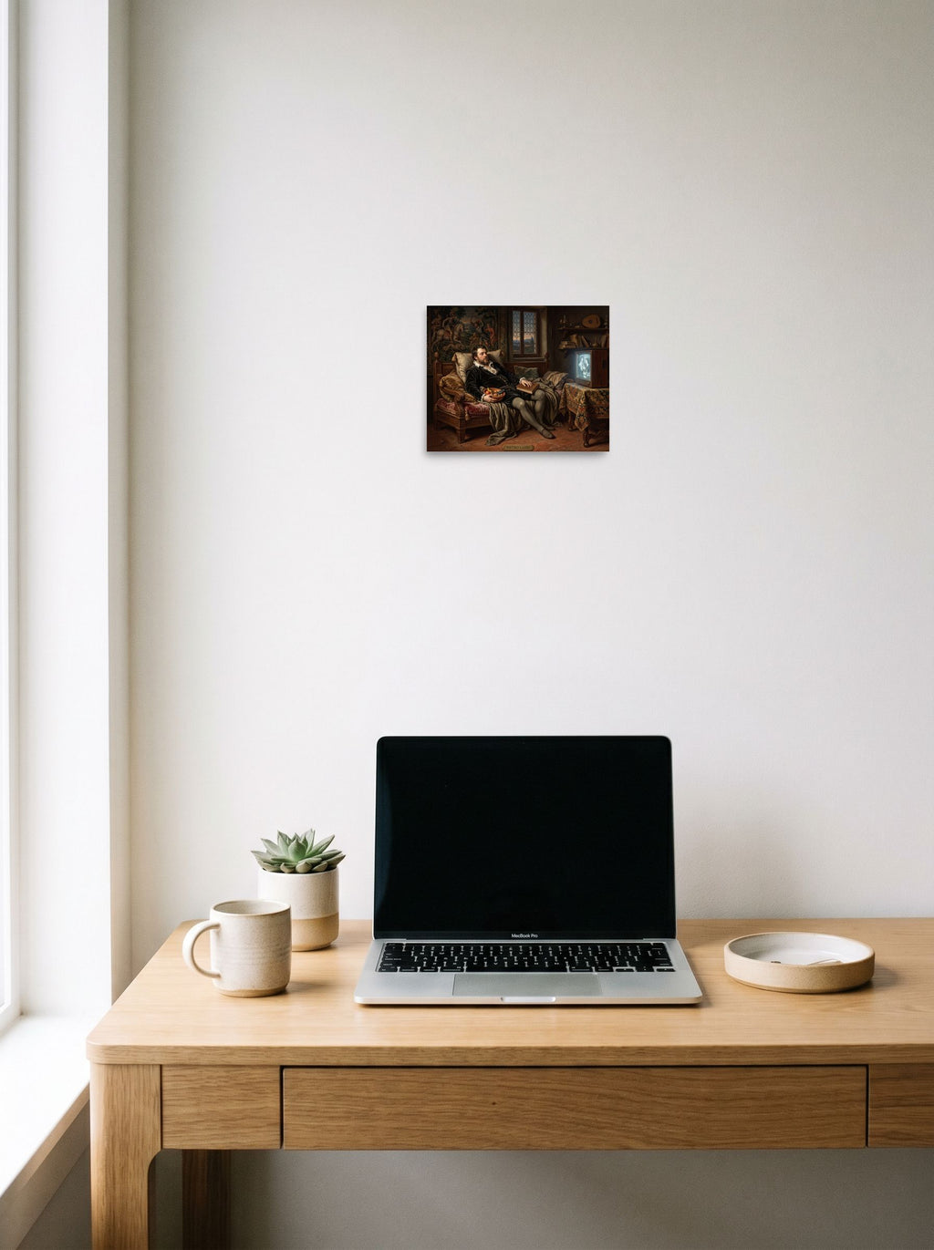 Mockup of 'The Renaissance Couch Potato' as a 10x8 inch unframed paper print, styled above a home-office workspace.