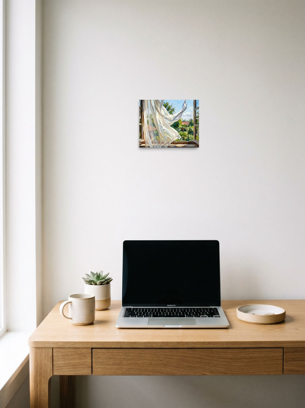 A 10x8 inch unframed paper Impressionism,Plein Air print of 'The Open Window' hanging above a worktable with a laptop.