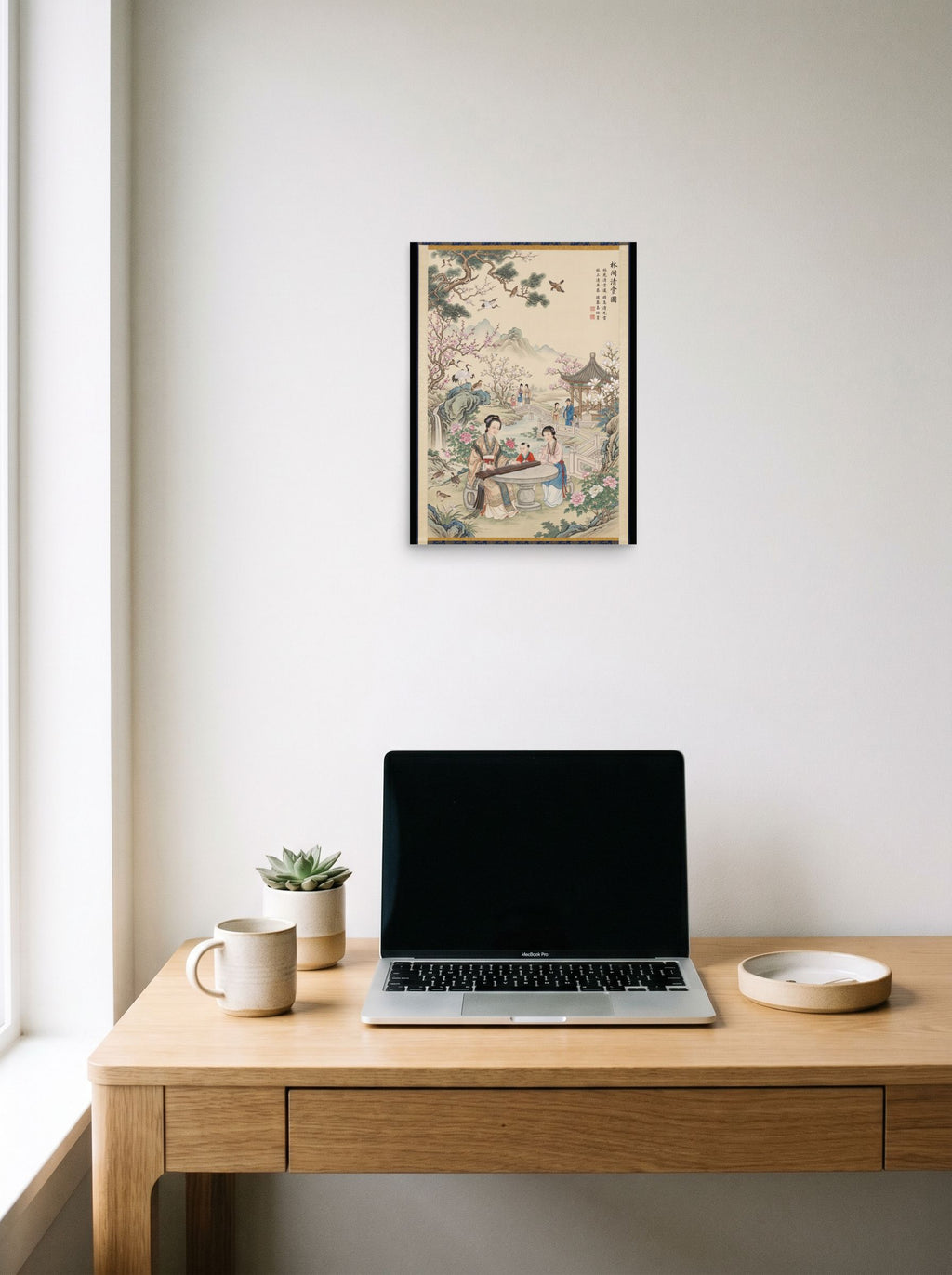A 12x16 inch unframed paper Fine Art print of 'Melody in the Spring Garden' hanging above a worktable with a laptop.