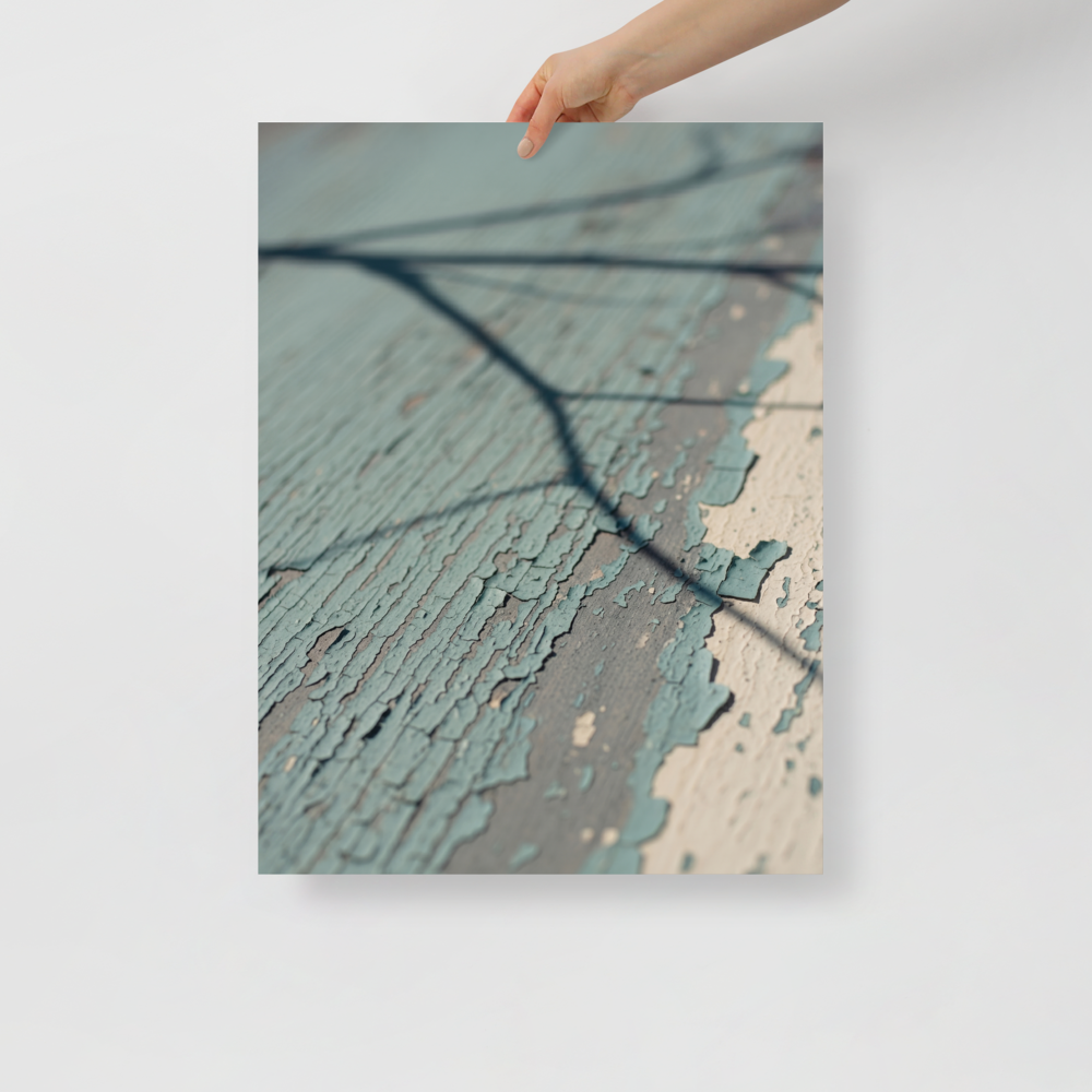 'Fading Blue' — a Art photography print. A close-up photograph of peeling light blue paint on weathered wood with a sharp shadow of a tree branch, suitable for a cozy Sunroom or Bedroom.