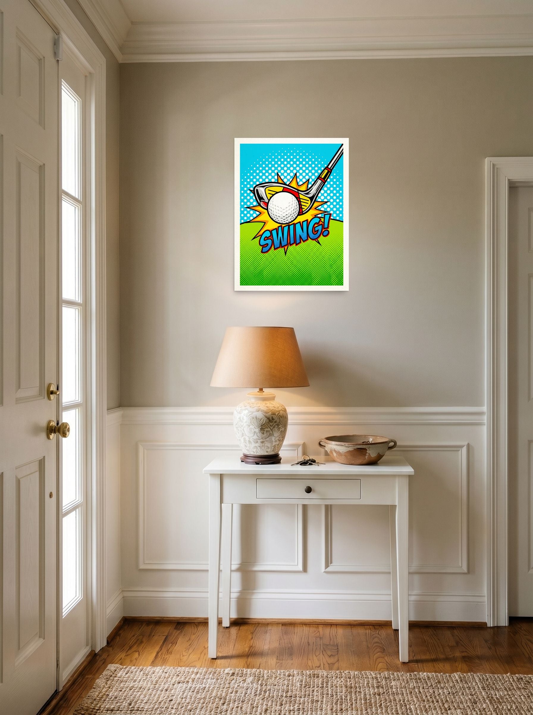 A 18x24 inch unframed paper Pop art print of 'Comic Swing' hanging in an entryway near a console.
