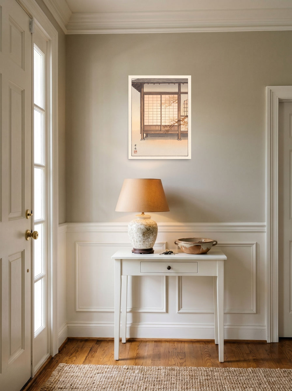 A 18x24 inch unframed paper Shin hanga print of 'Shadows on Shoji' hanging in an entryway near a console.