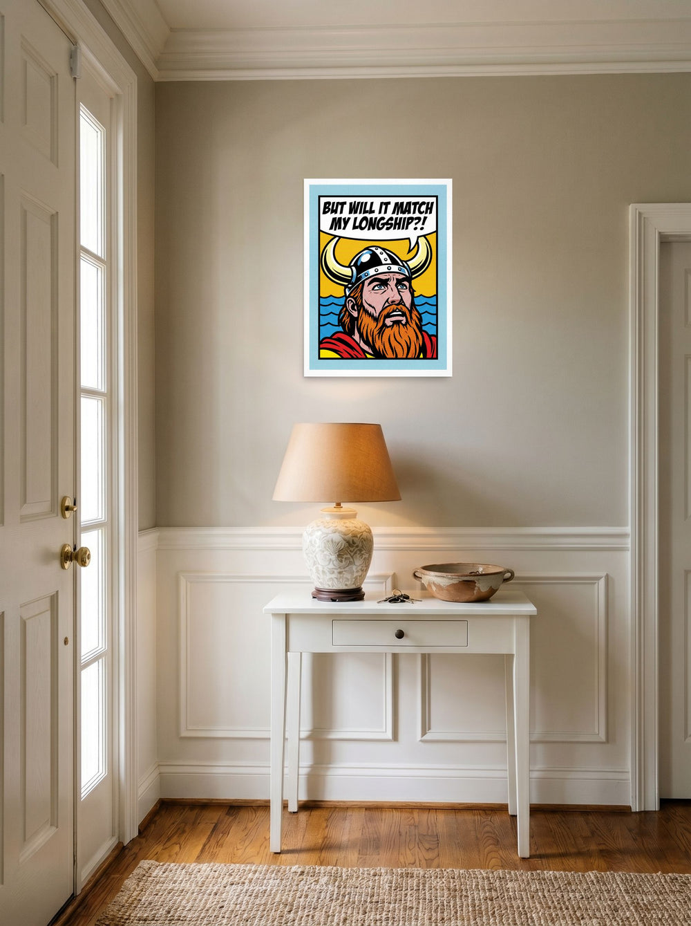 A 18x24 inch unframed paper Pop art print of 'Viking Decor Dilemma' hanging in an entryway near a console.