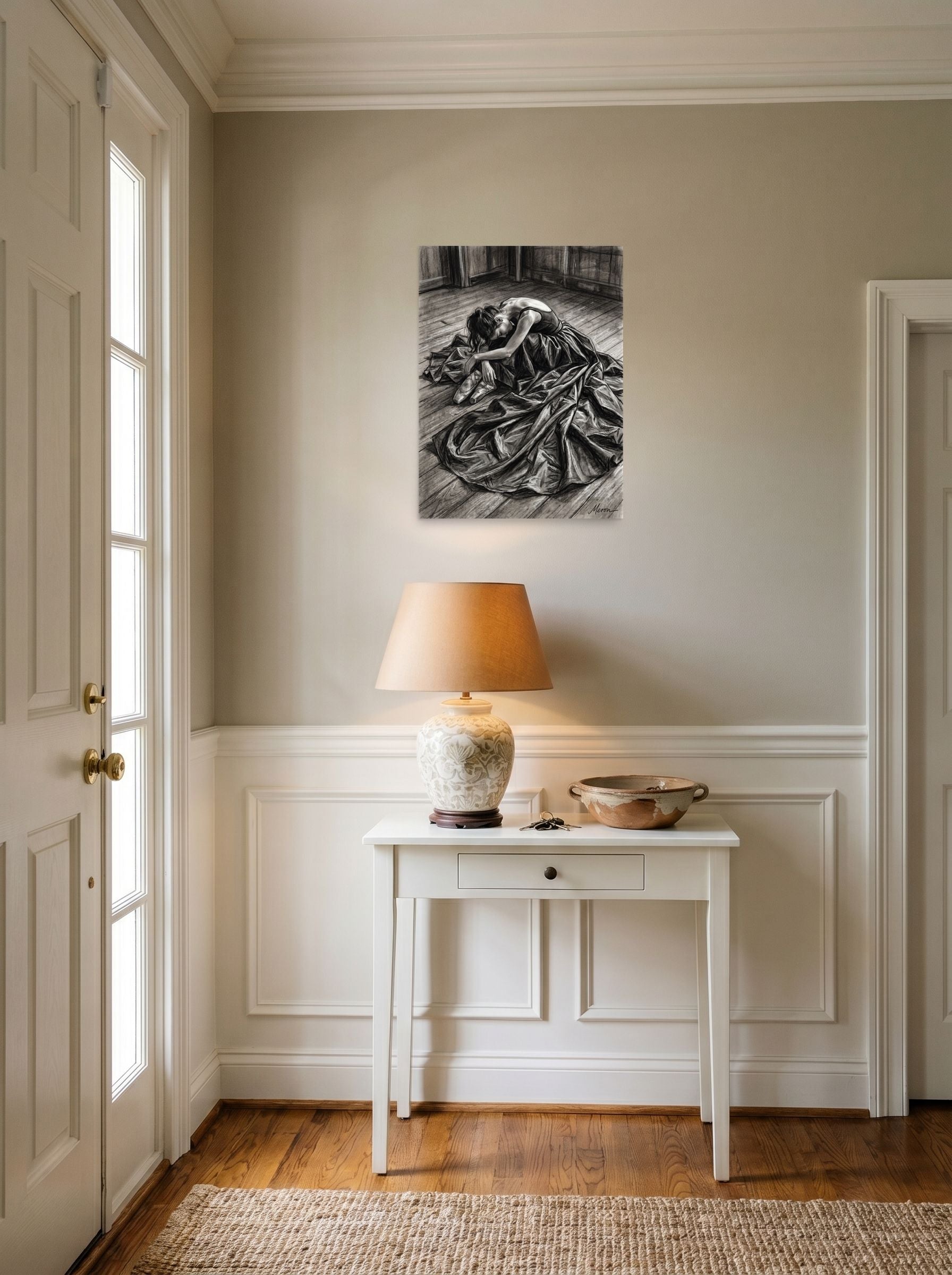 A 18x24 inch unframed paper Realism,Figurative art print of 'Quiet Exhaustion' hanging in an entryway near a console.