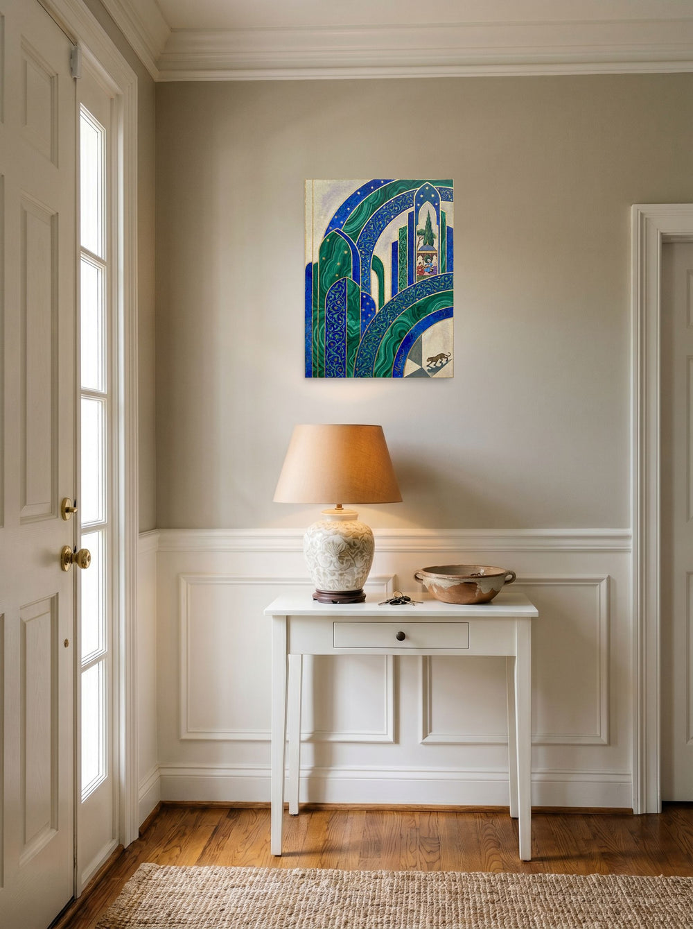 A 18x24 inch unframed paper Art Deco print of 'Malachite Palace' hanging in an entryway near a console.