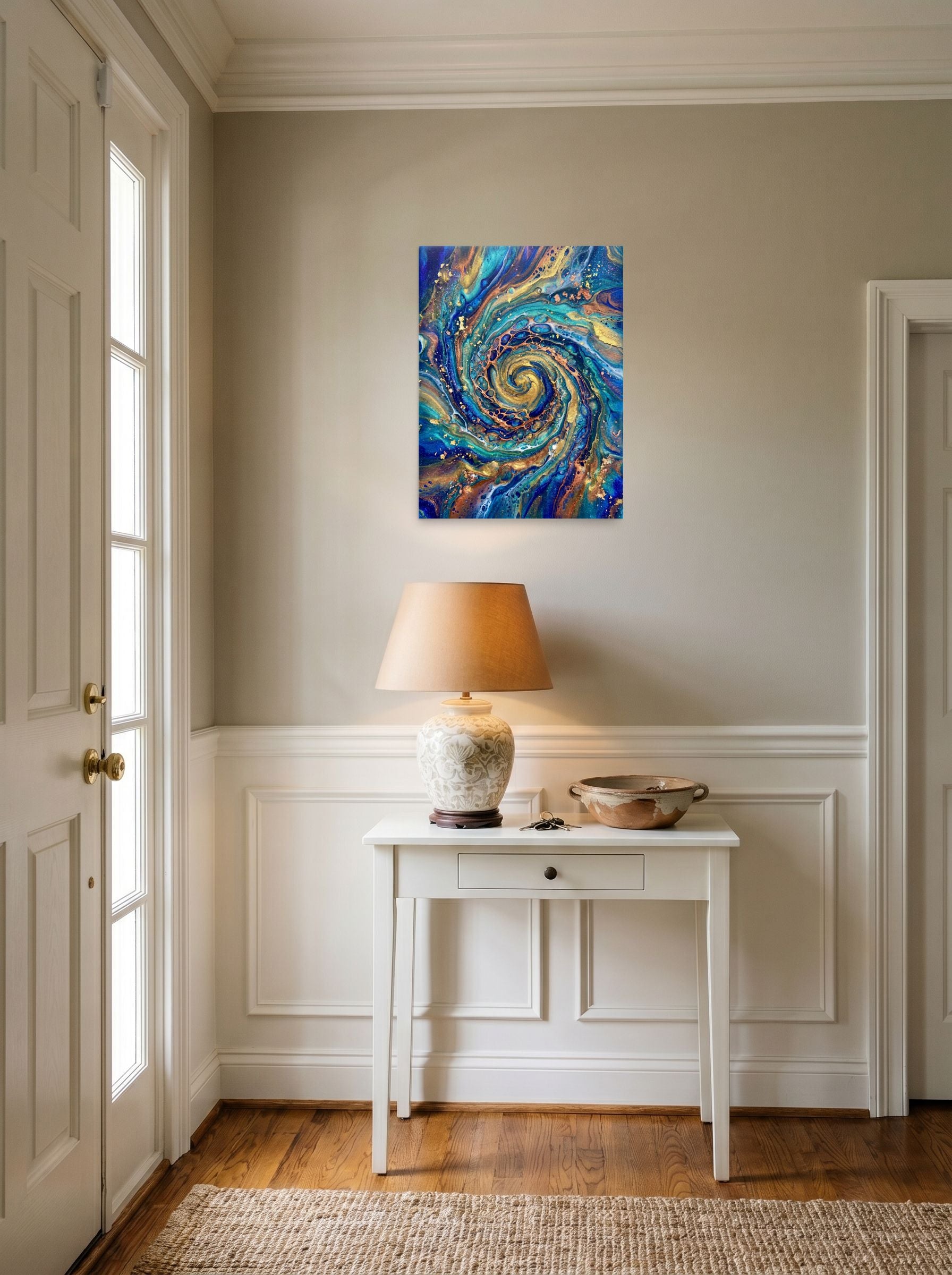 A 18x24 inch unframed paper Abstract art print of 'Golden Vortex' hanging in an entryway near a console.