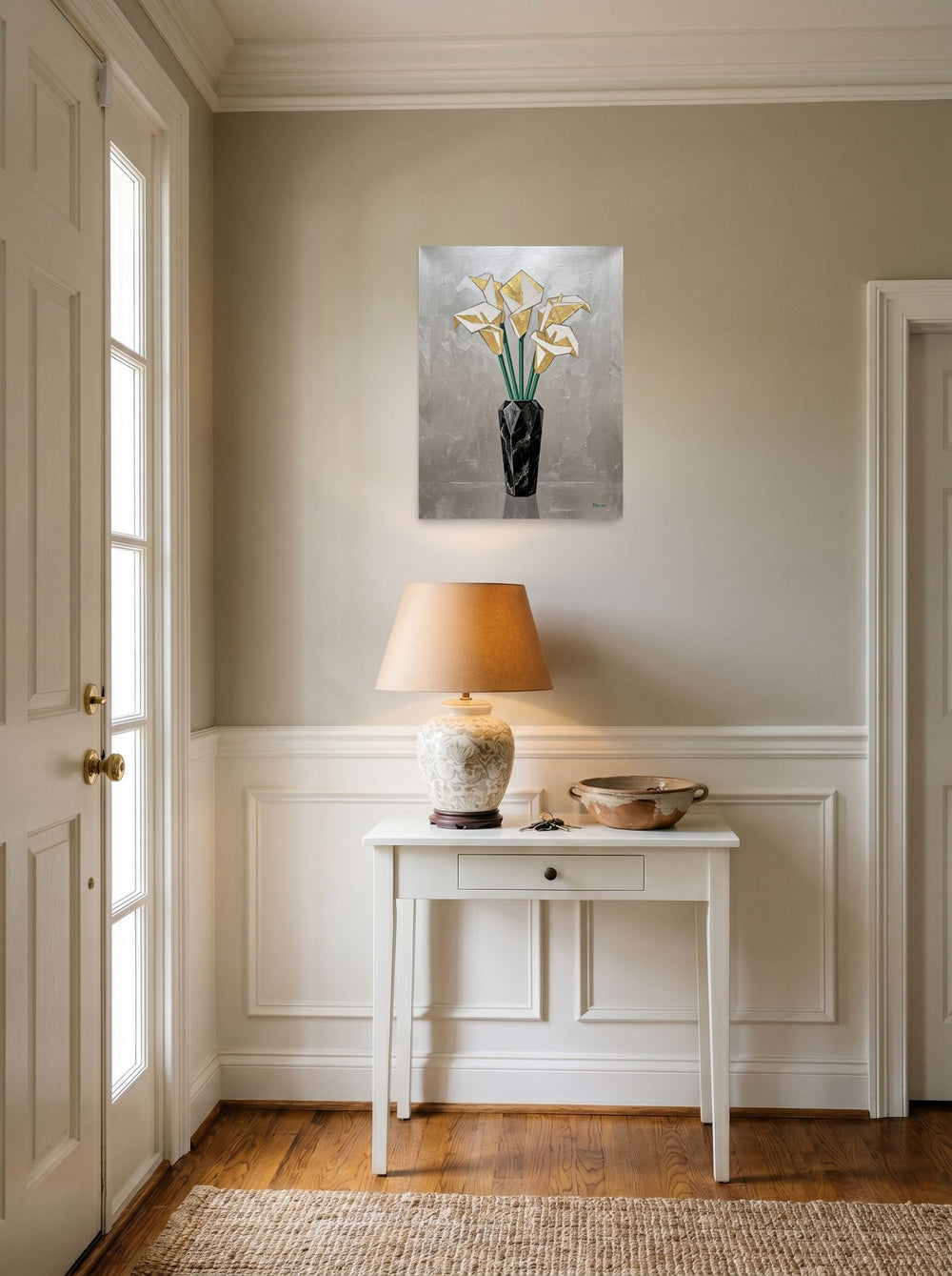 A 18x24 inch unframed paper Art Deco print of 'Deco Calla Lilies' hanging in an entryway near a console.