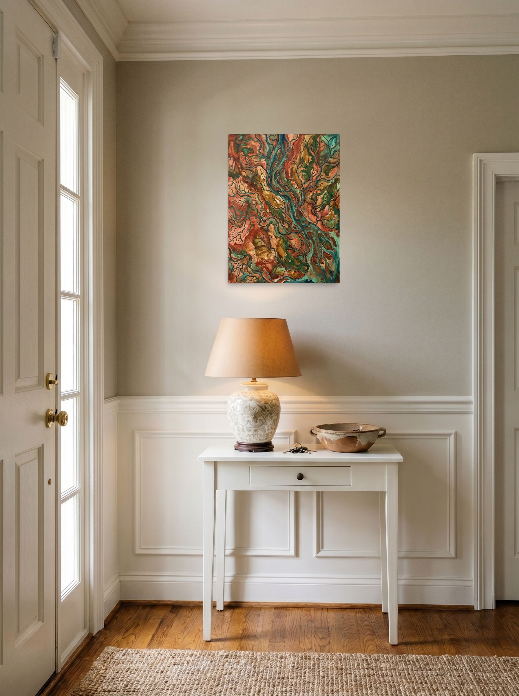 A 18x24 inch unframed paper Abstract expressionism,Abstract art print of 'Earth Veins' hanging in an entryway near a console.