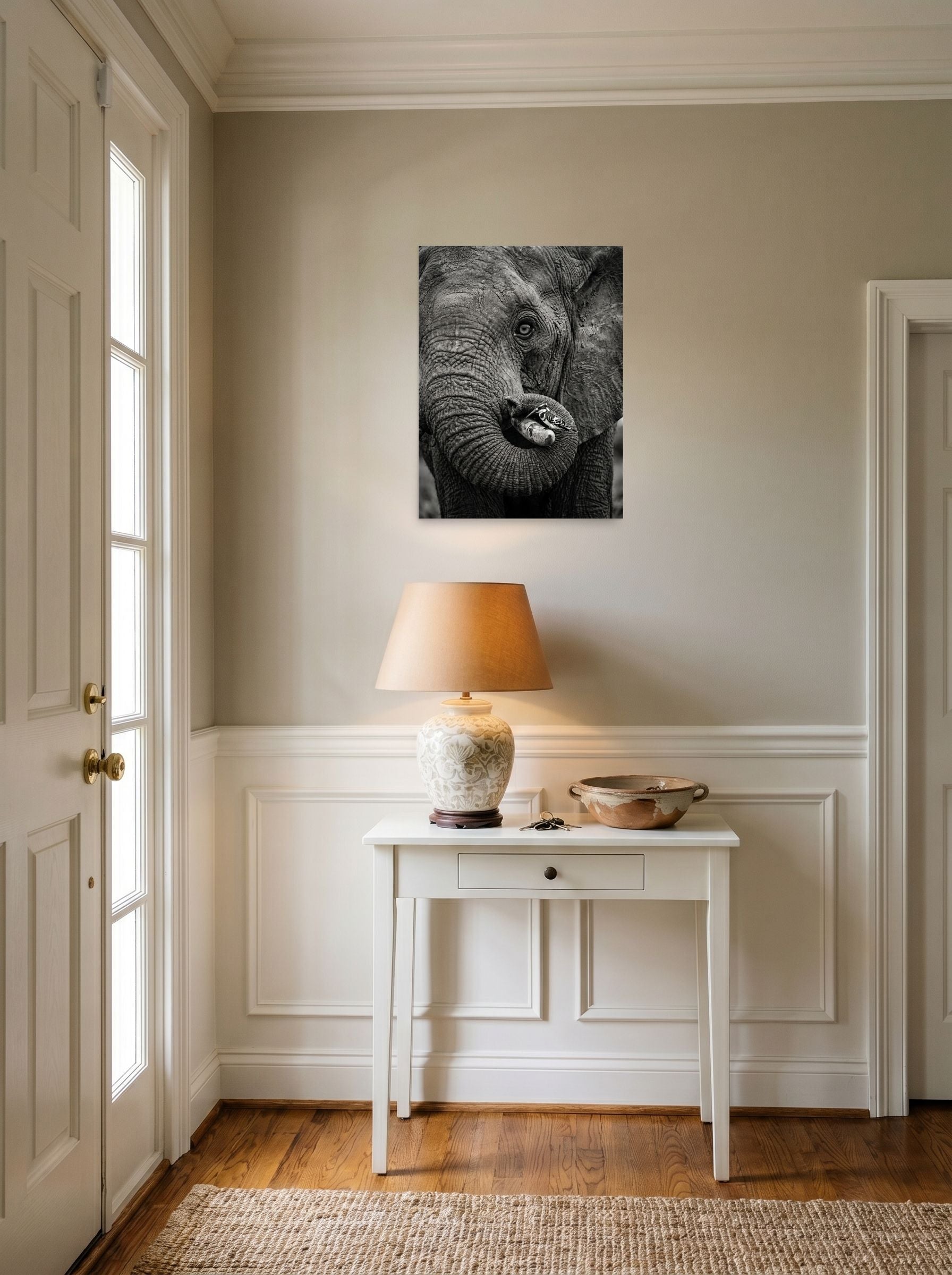 A 18x24 inch unframed paper Art photography print of 'Symbiosis in Monochrome' hanging in an entryway near a console.