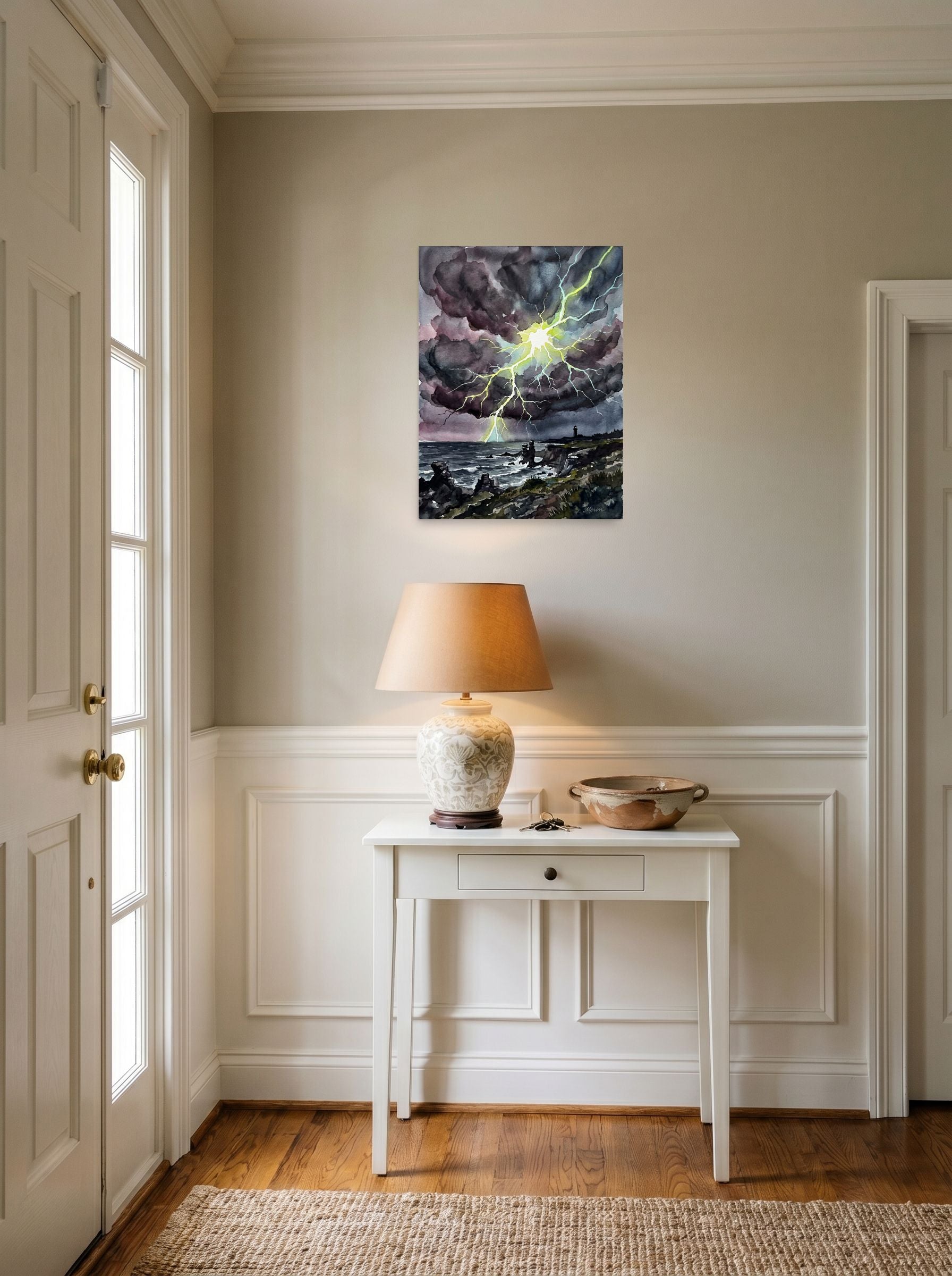 A 18x24 inch unframed paper Expressionism print of 'Coastal Thunderstorm II' hanging in an entryway near a console.
