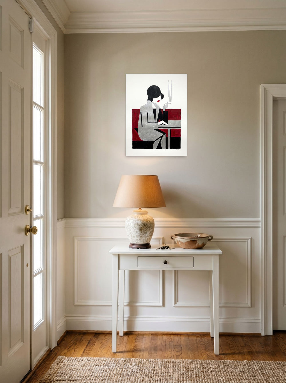 A 18x24 inch unframed paper Art Deco,Cubism print of 'Café Silhouette' hanging in an entryway near a console.