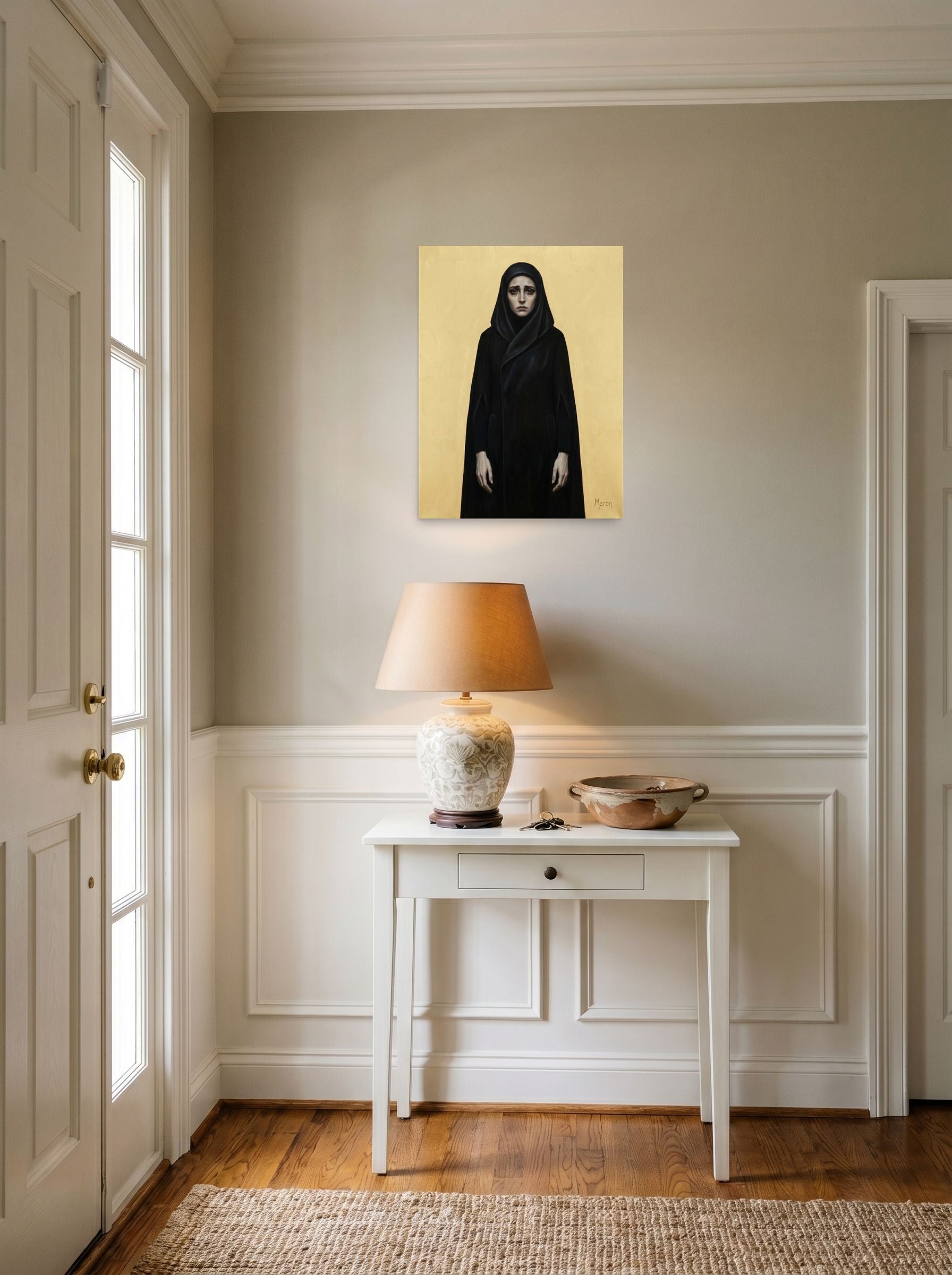 A 18x24 inch unframed paper Figurative art,Symbolism print of 'The Grieving Matriarch' hanging in an entryway near a console.