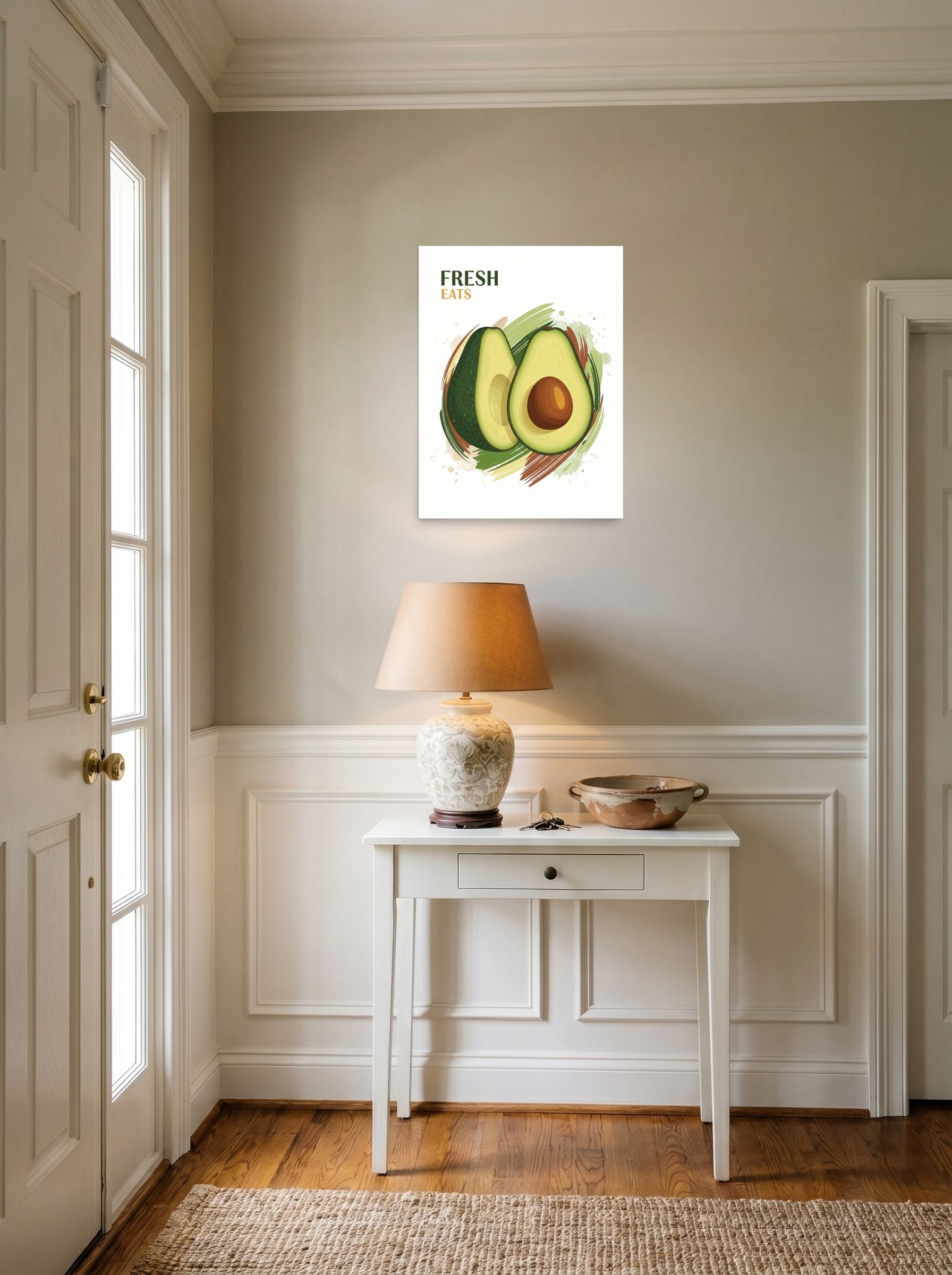 A 18x24 inch unframed paper Pop art,Digital art print of 'Fresh Eats Avocado' hanging in an entryway near a console.