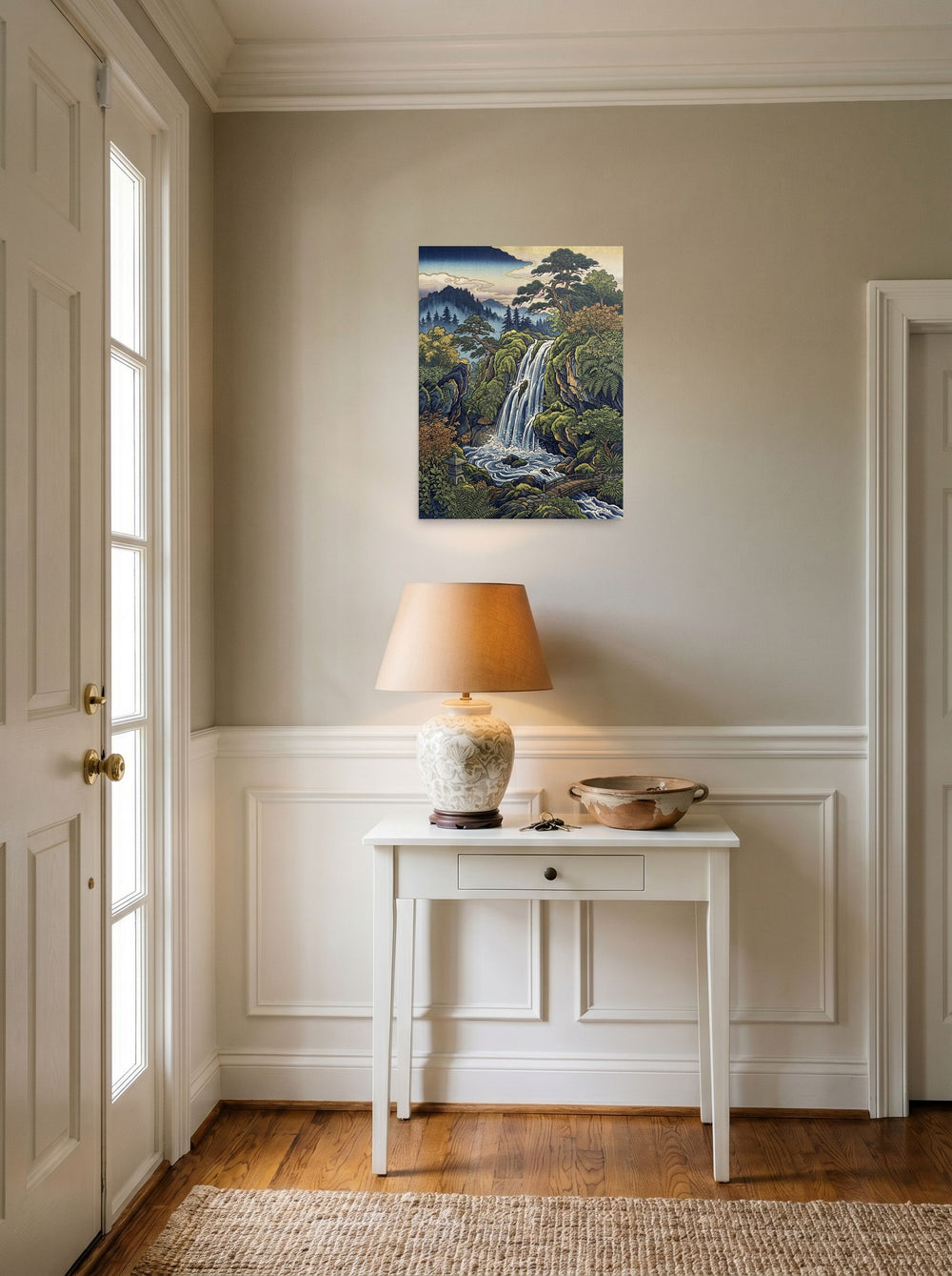 A 18x24 inch unframed paper Ukiyo-e print of 'Hidden Falls' hanging in an entryway near a console.