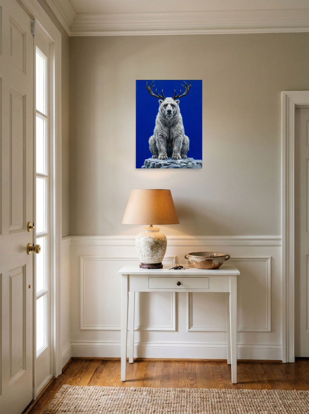 A 18x24 inch unframed paper Surrealism,Expressionism print of 'The Horned Bear' hanging in an entryway near a console.