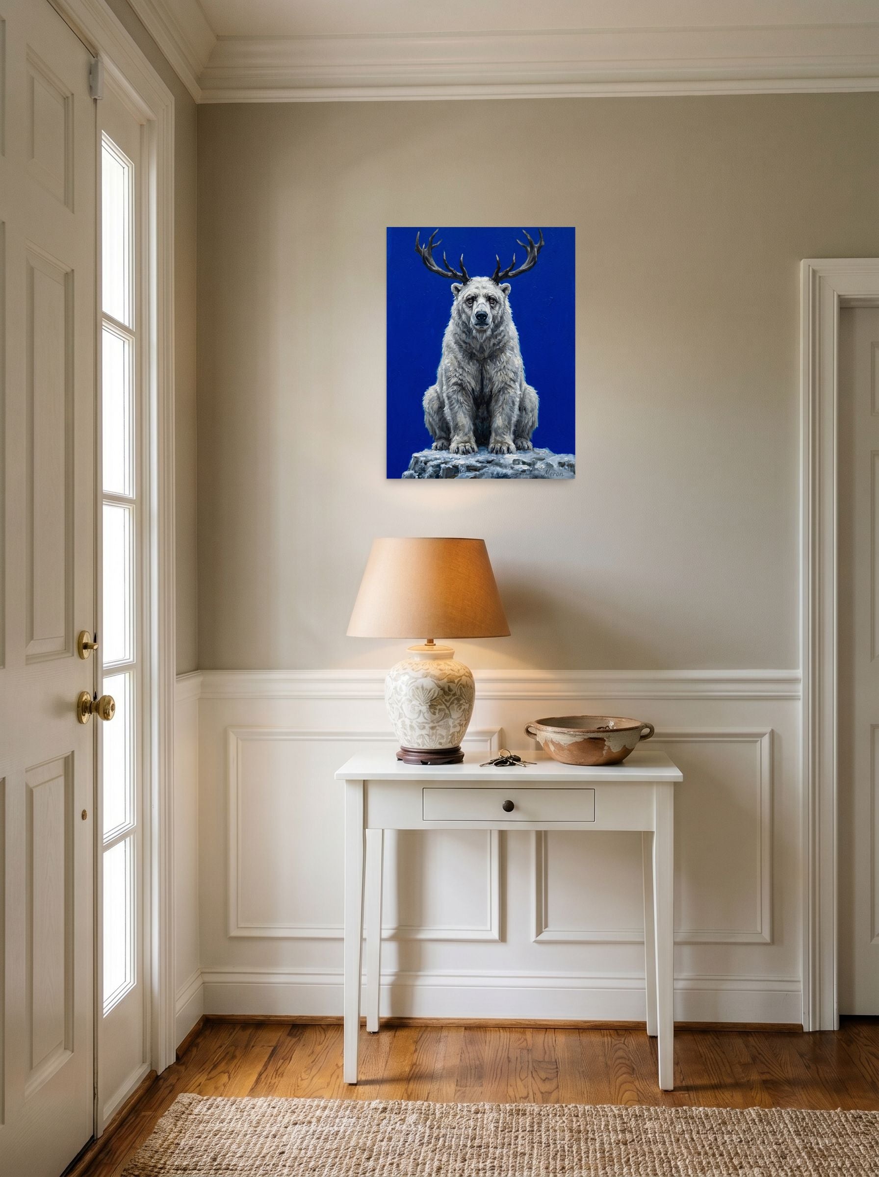 A 18x24 inch unframed paper Surrealism,Expressionism print of 'The Horned Bear' hanging in an entryway near a console.