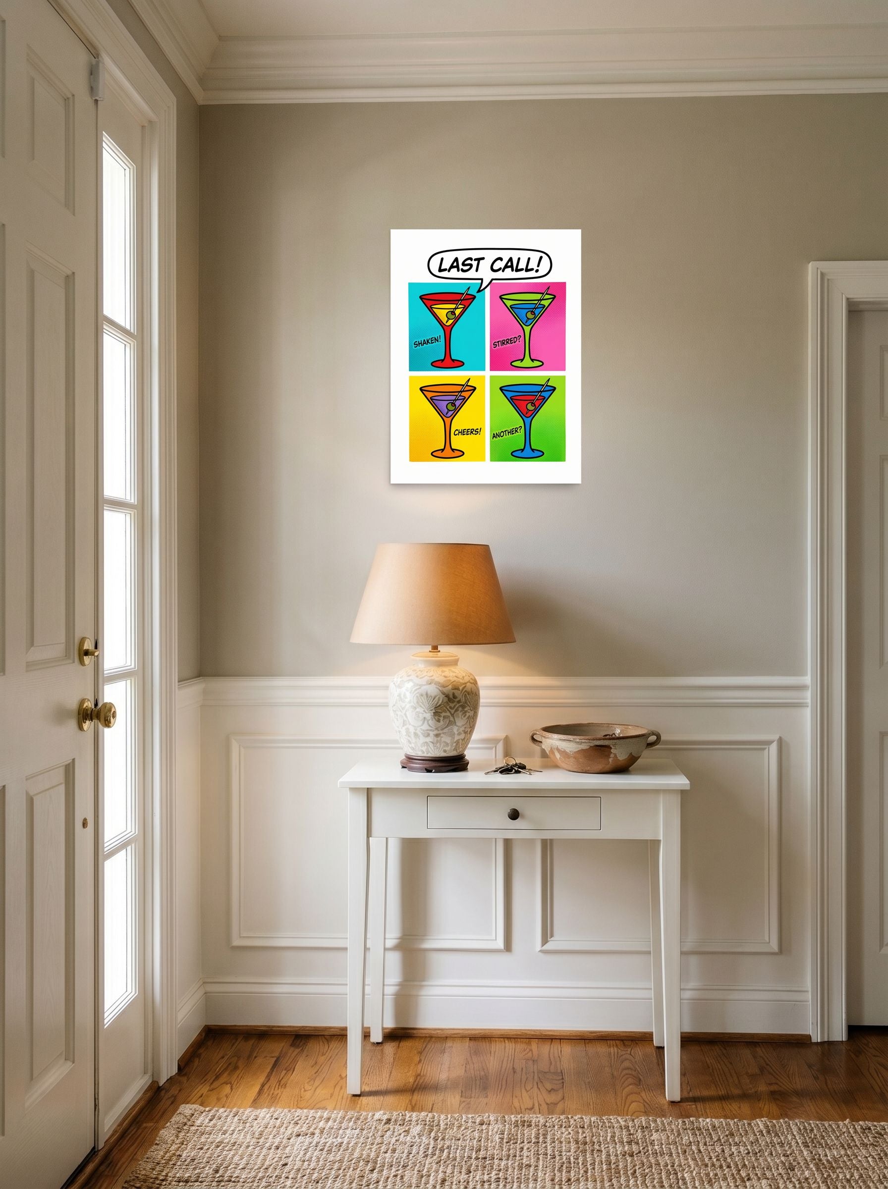 A 18x24 inch unframed paper Pop art print of 'Last Call' hanging in an entryway near a console.