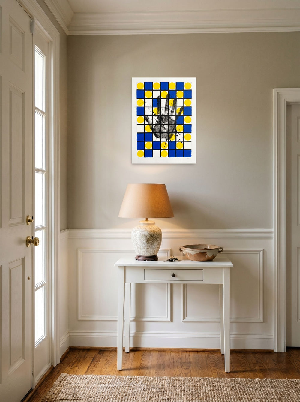 A unframed paper print of the De Stijl (also known as Neoplasticism) artwork 'Human Grid', styled above a console table in an entryway.