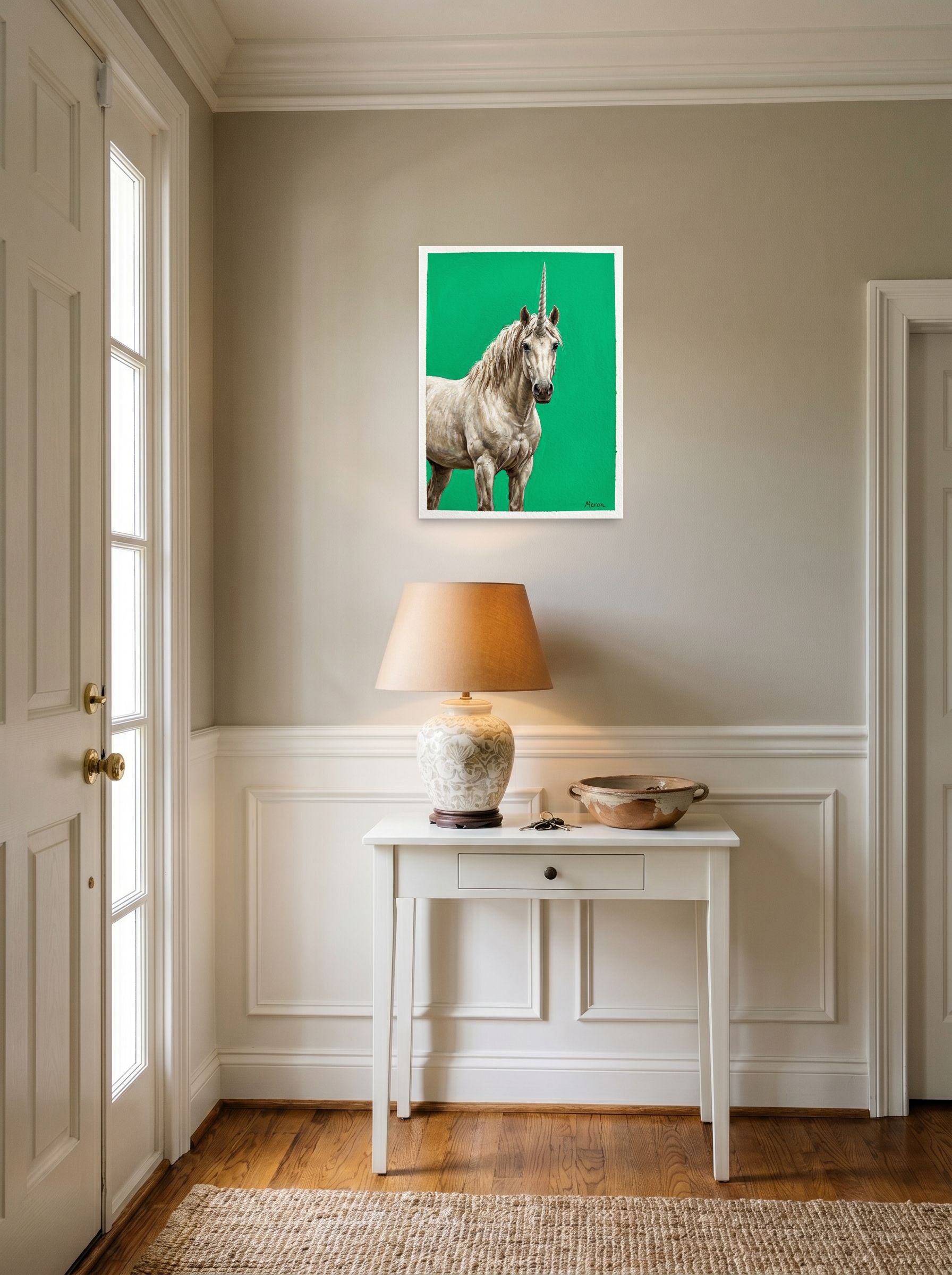 A 18x24 inch unframed paper Realism print of 'The Emerald Unicorn' hanging in an entryway near a console.