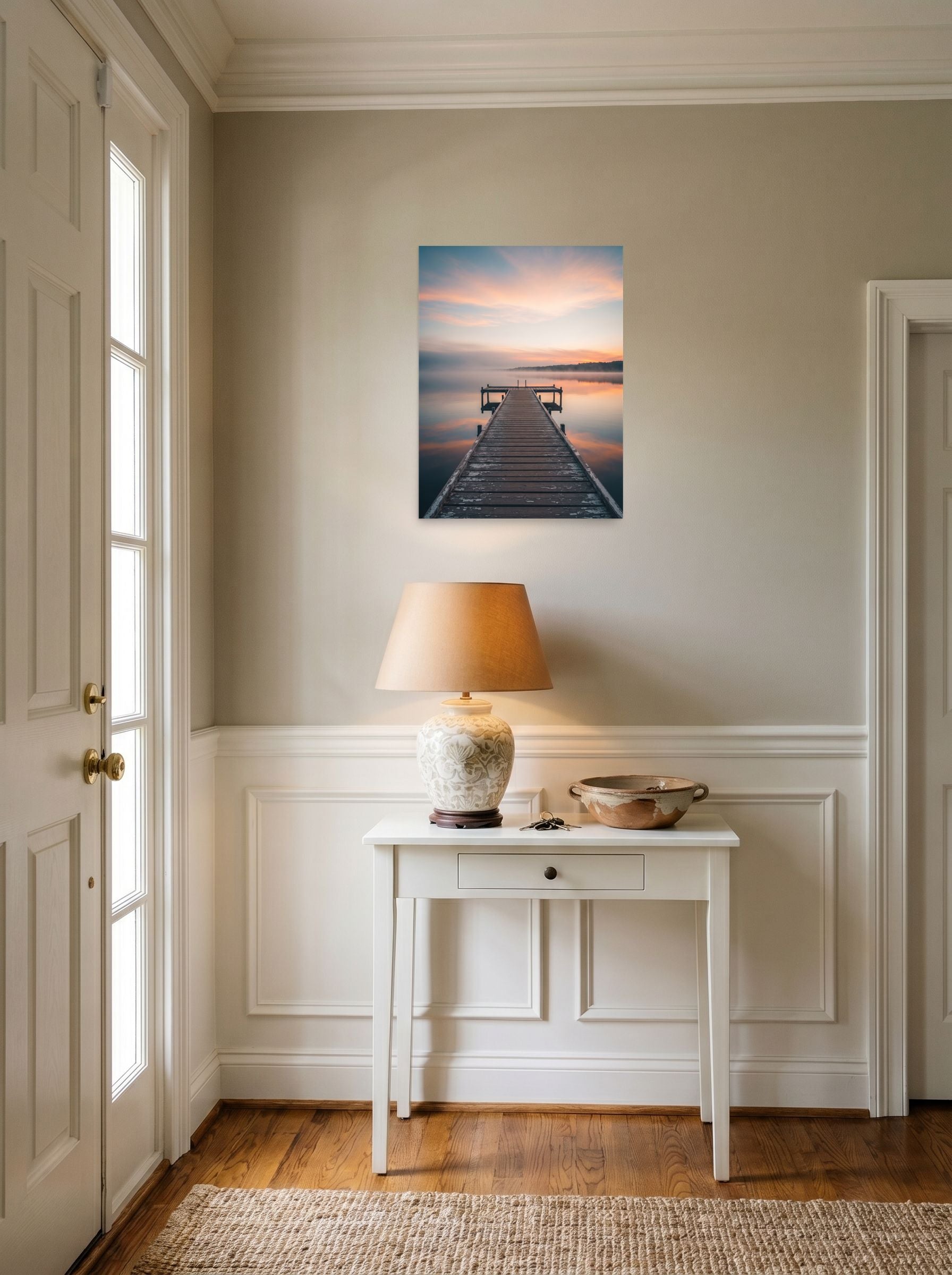 A 18x24 inch unframed paper Art photography print of 'Pastel Dawn Pier' hanging in an entryway near a console.