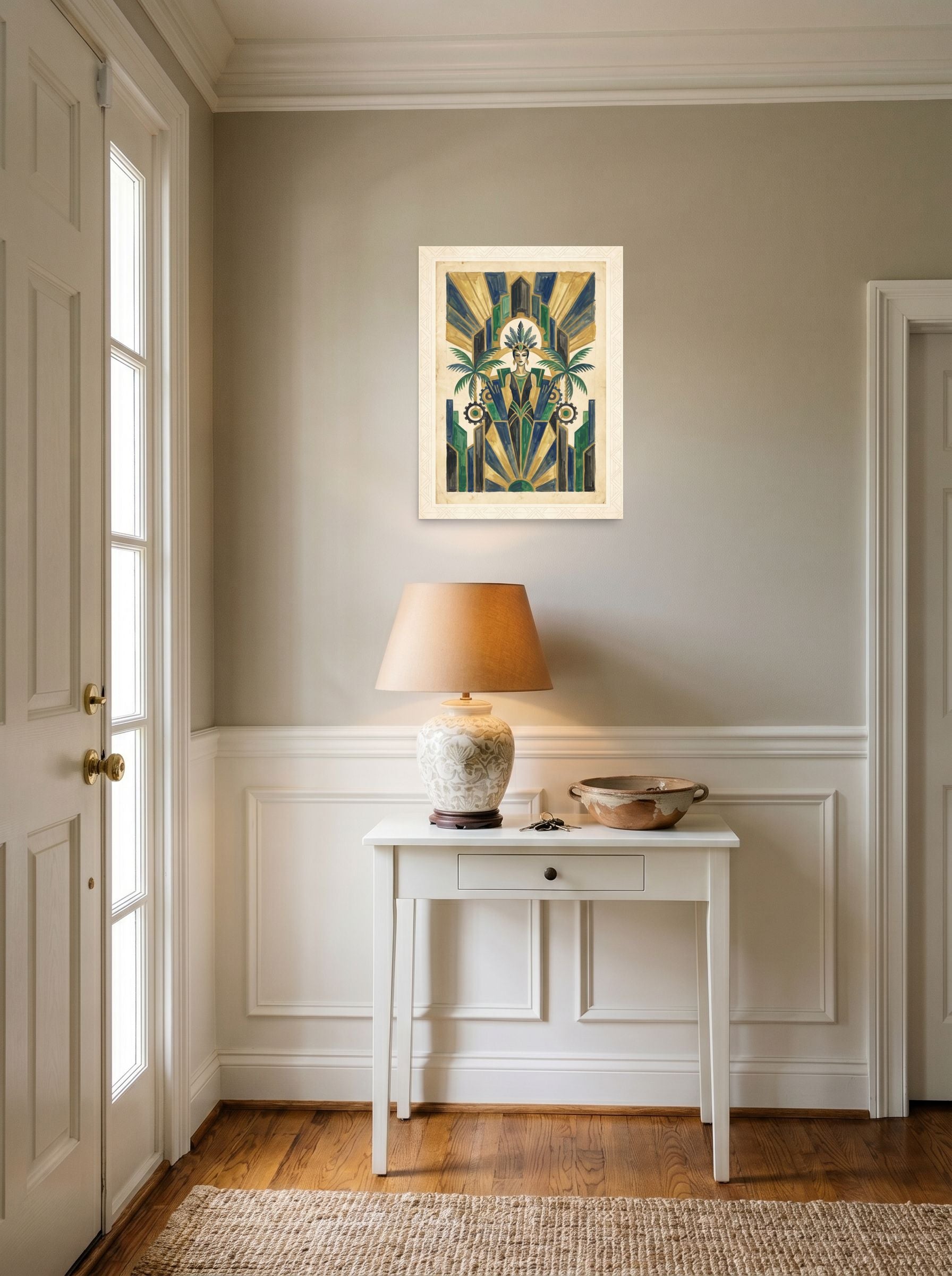 A 18x24 inch unframed paper Art Deco print of 'The Deco Oasis' hanging in an entryway near a console.