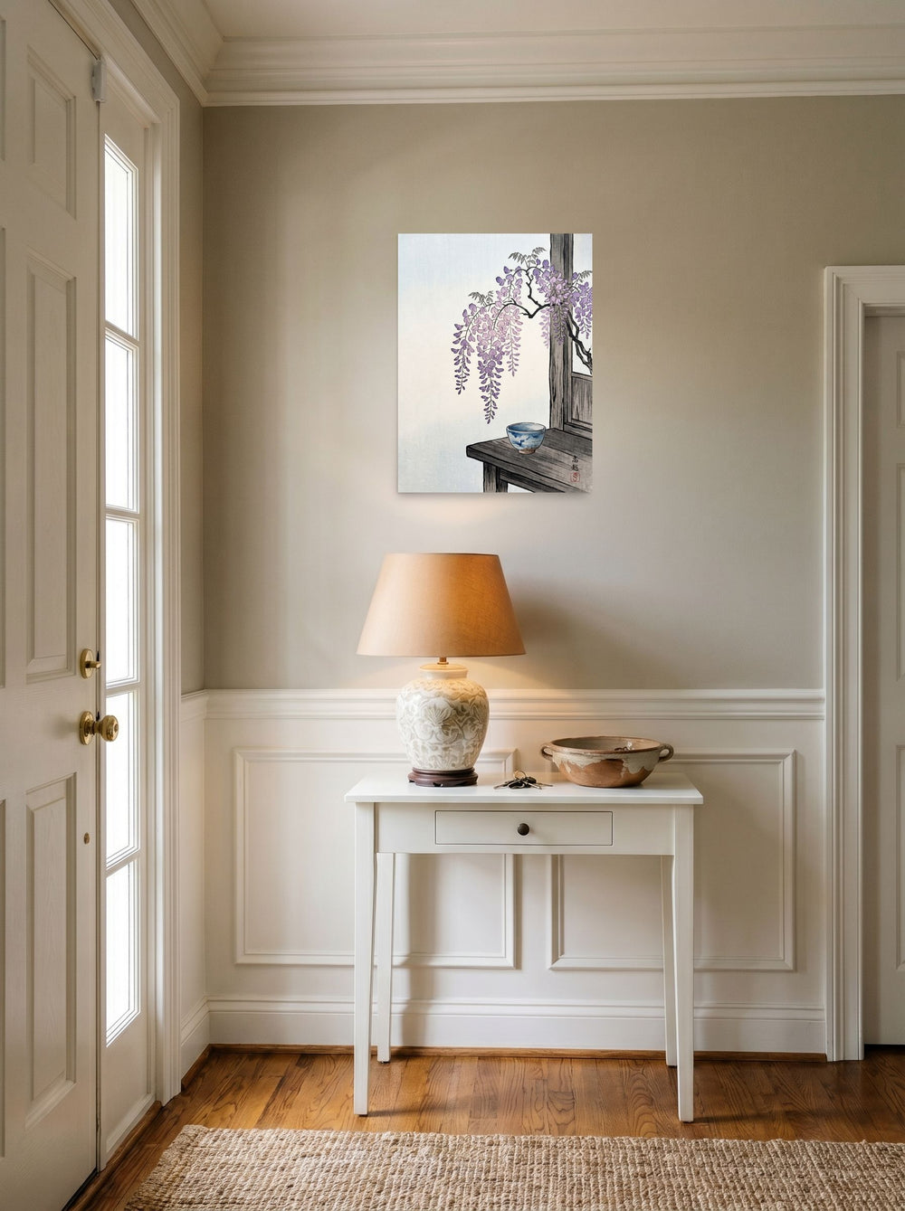A 18x24 inch unframed paper Shin hanga print of 'Wisteria and Tea' hanging in an entryway near a console.