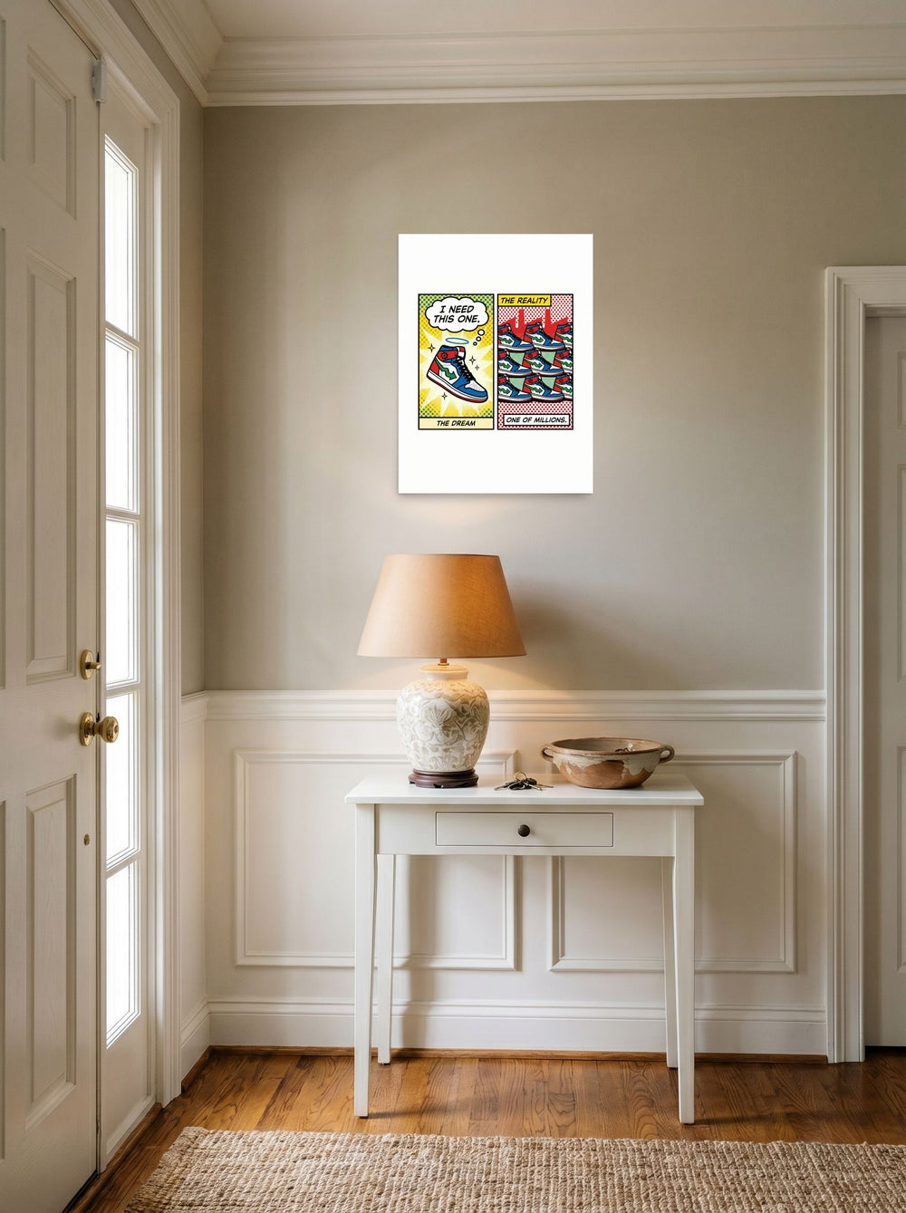 A 18x24 inch unframed paper Pop art print of 'The Sneaker Illusion' hanging in an entryway near a console.