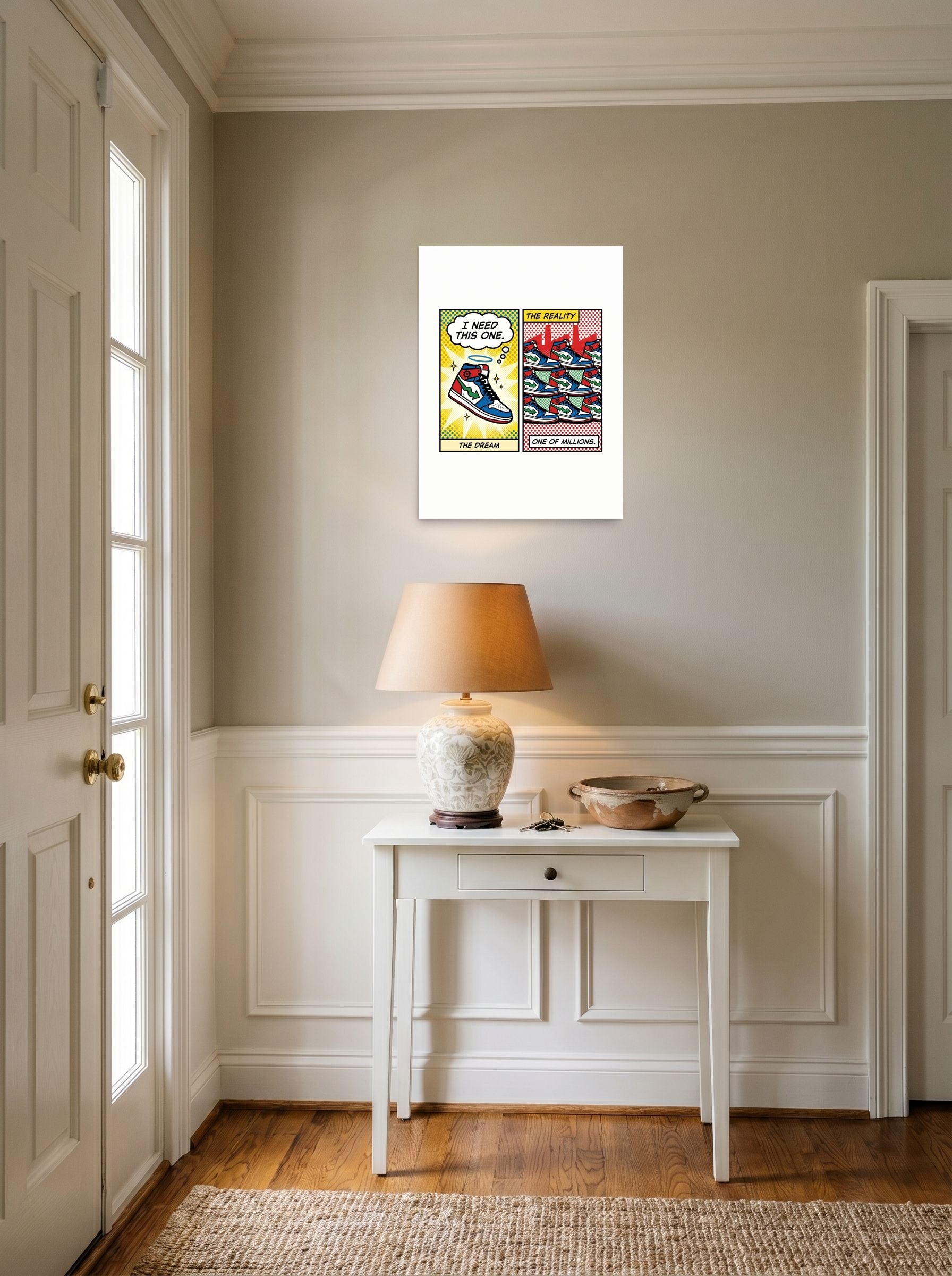 A 18x24 inch unframed paper Pop art print of 'The Sneaker Illusion' hanging in an entryway near a console.