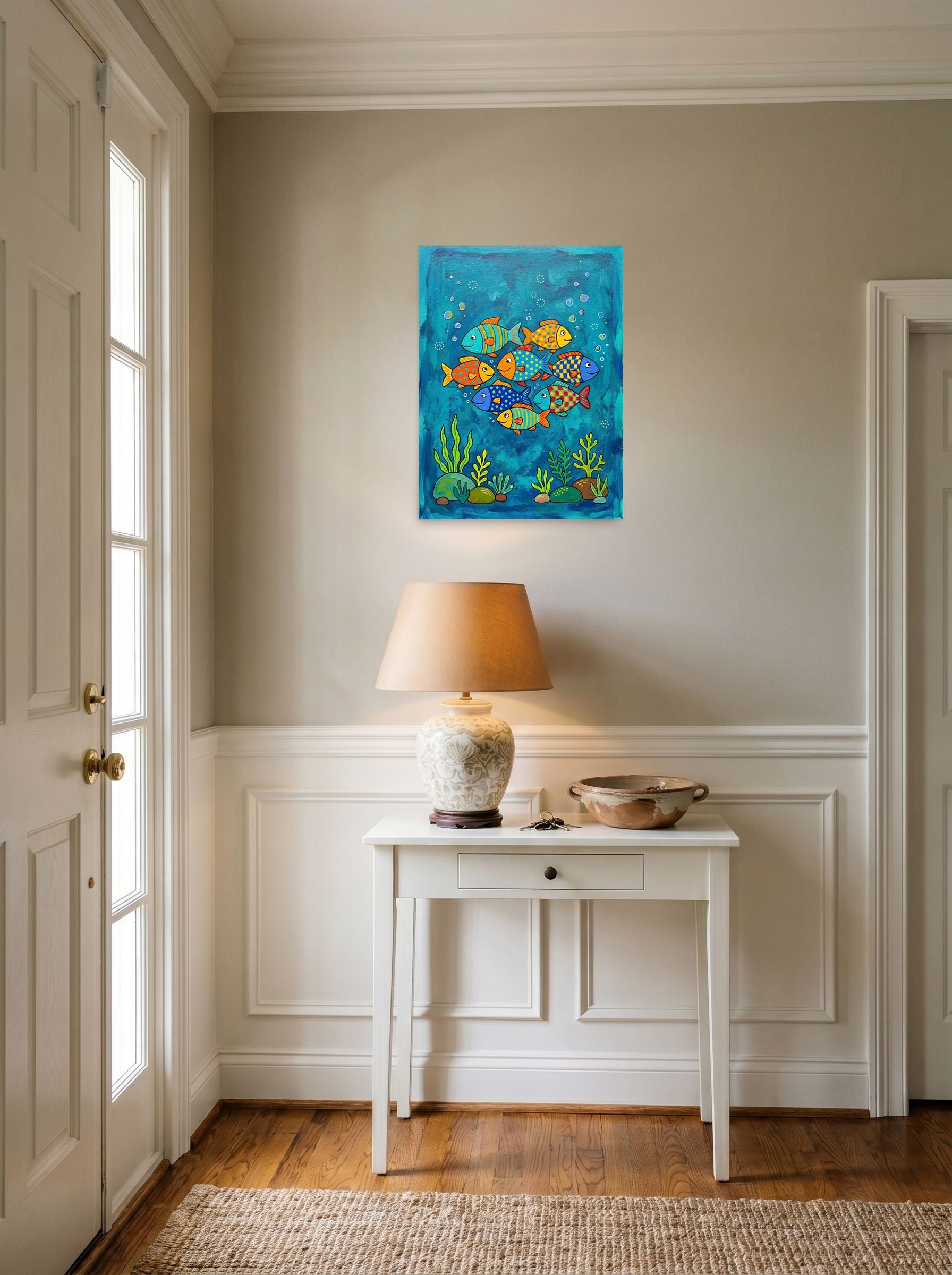 A 18x24 inch unframed paper Naive art print of 'Colorful Ocean Friends' hanging in an entryway near a console.