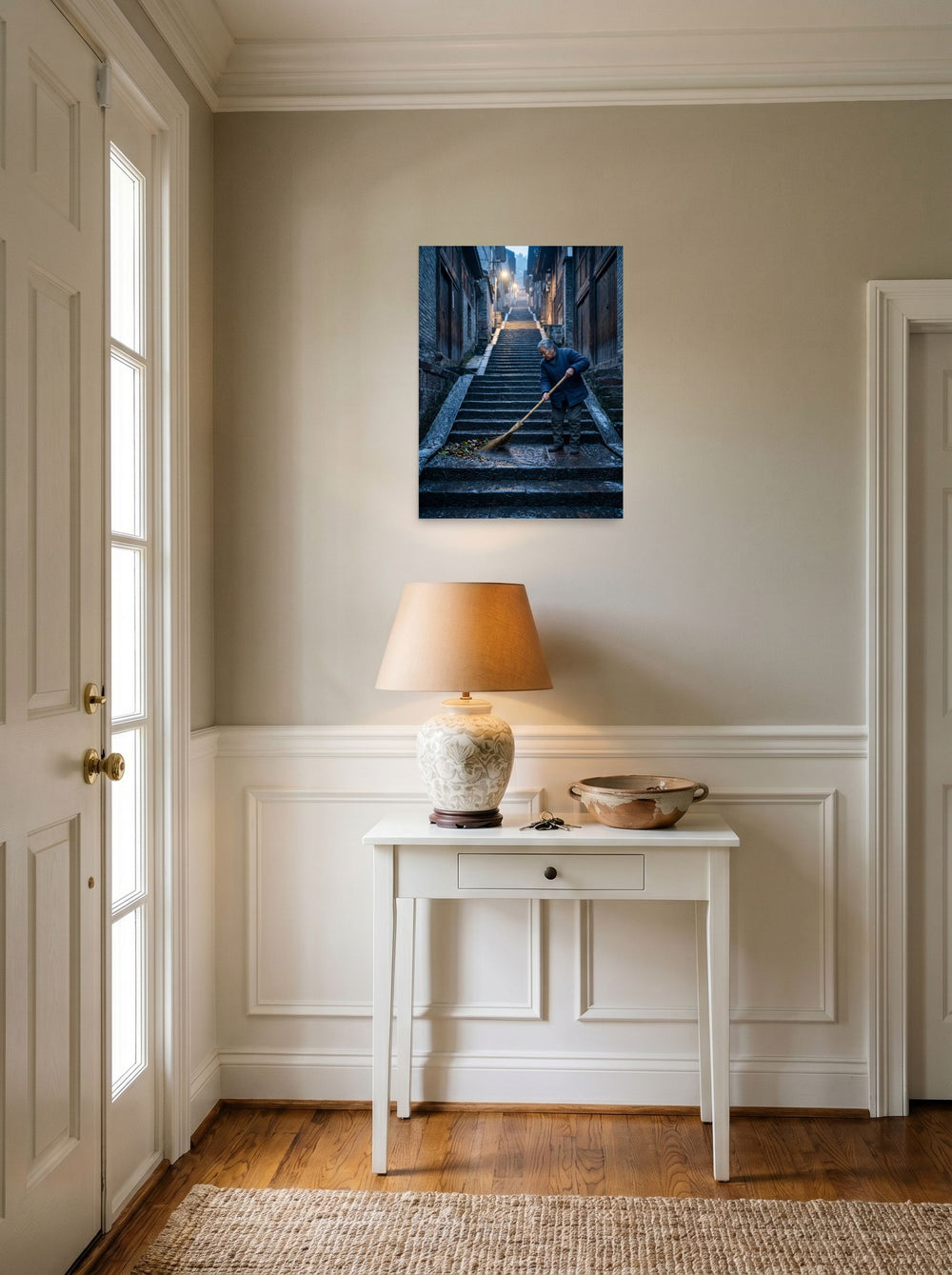 The unframed paper print 'Dawn on the Steps' set against a bright entryway wall, shown at 18x24 inch.