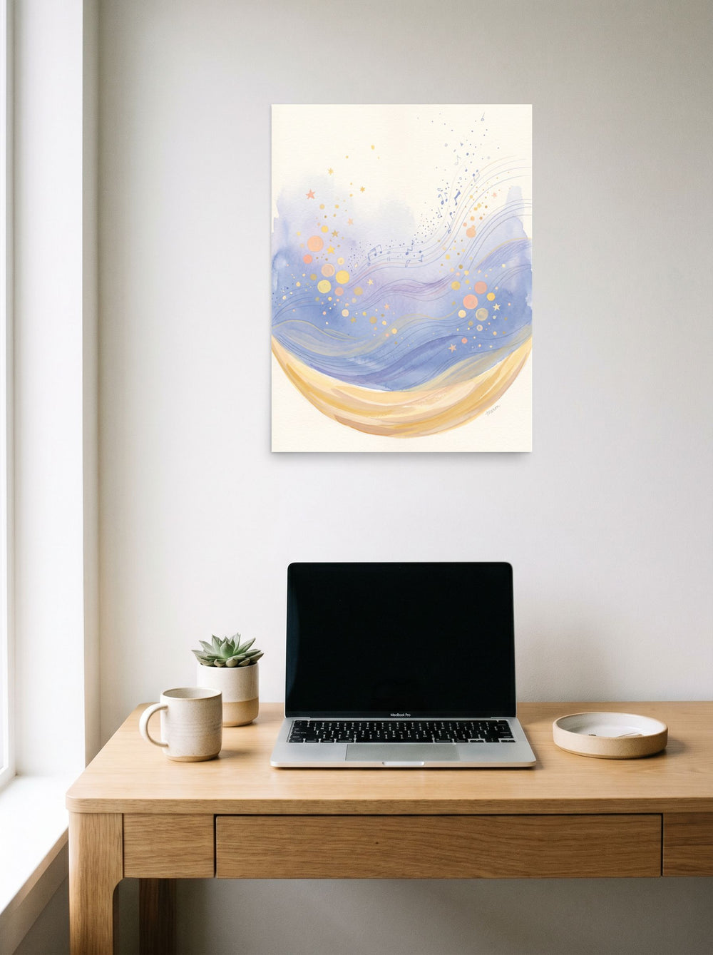 18x24 inch unframed paper print of 'Crescent Lullaby', hanging above a worktable with a laptop.