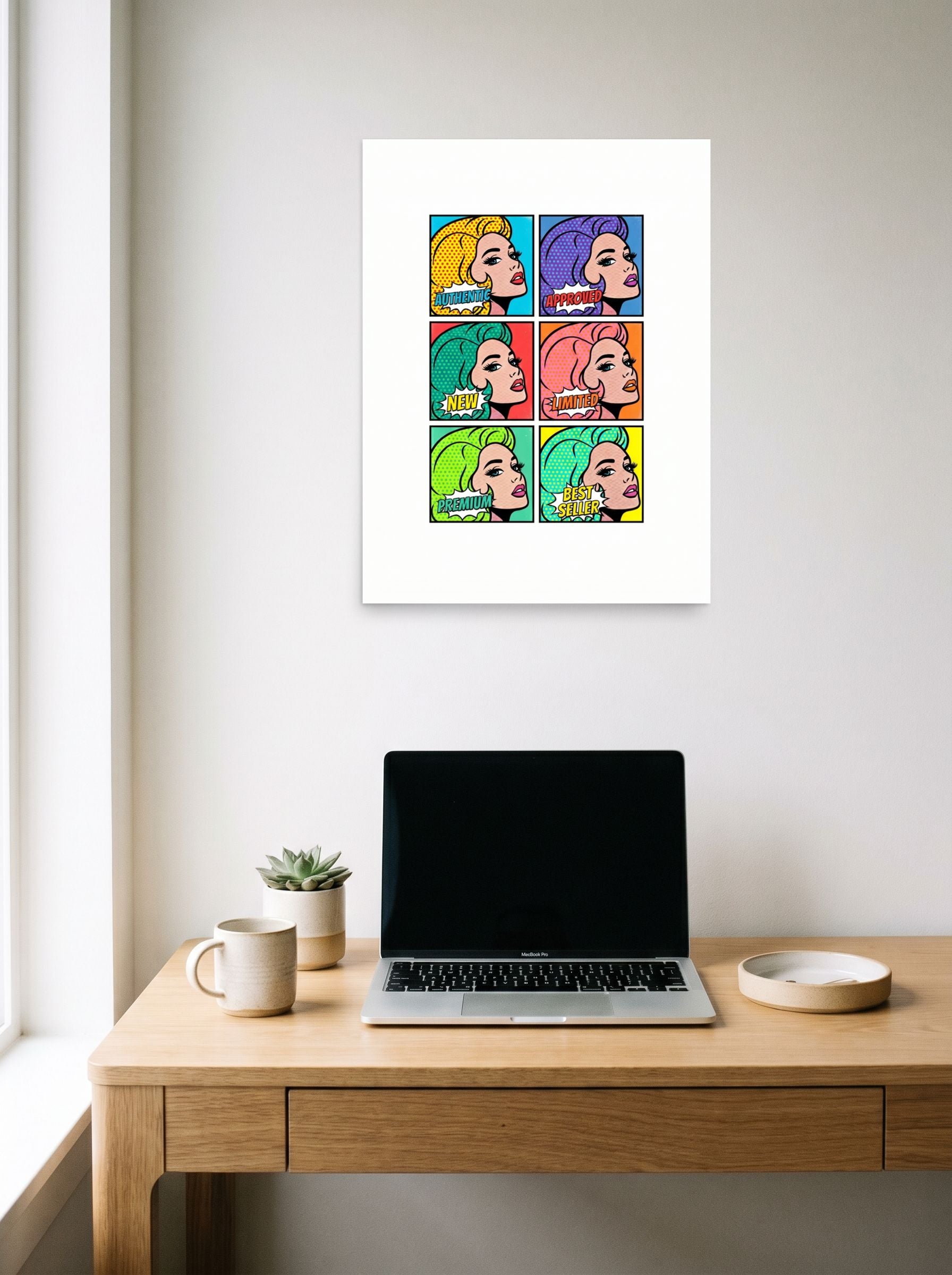 A 18x24 inch unframed paper Pop art print of 'The Six Faces of Consumerism' hanging above a worktable with a laptop.