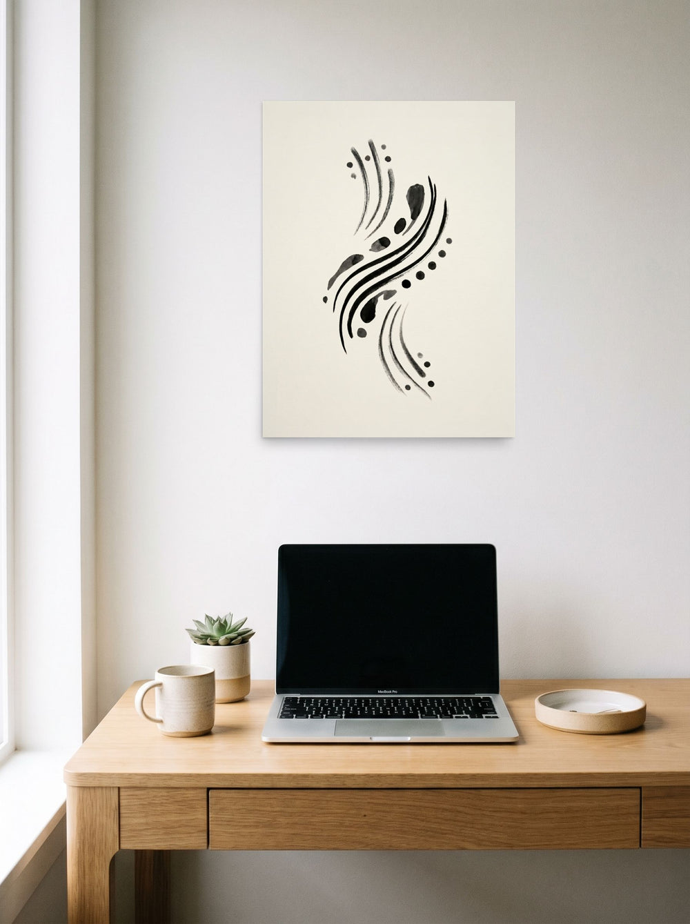 A 18x24 inch unframed paper Minimalism,Abstract art print of 'Fluid Cadence' hanging above a worktable with a laptop.