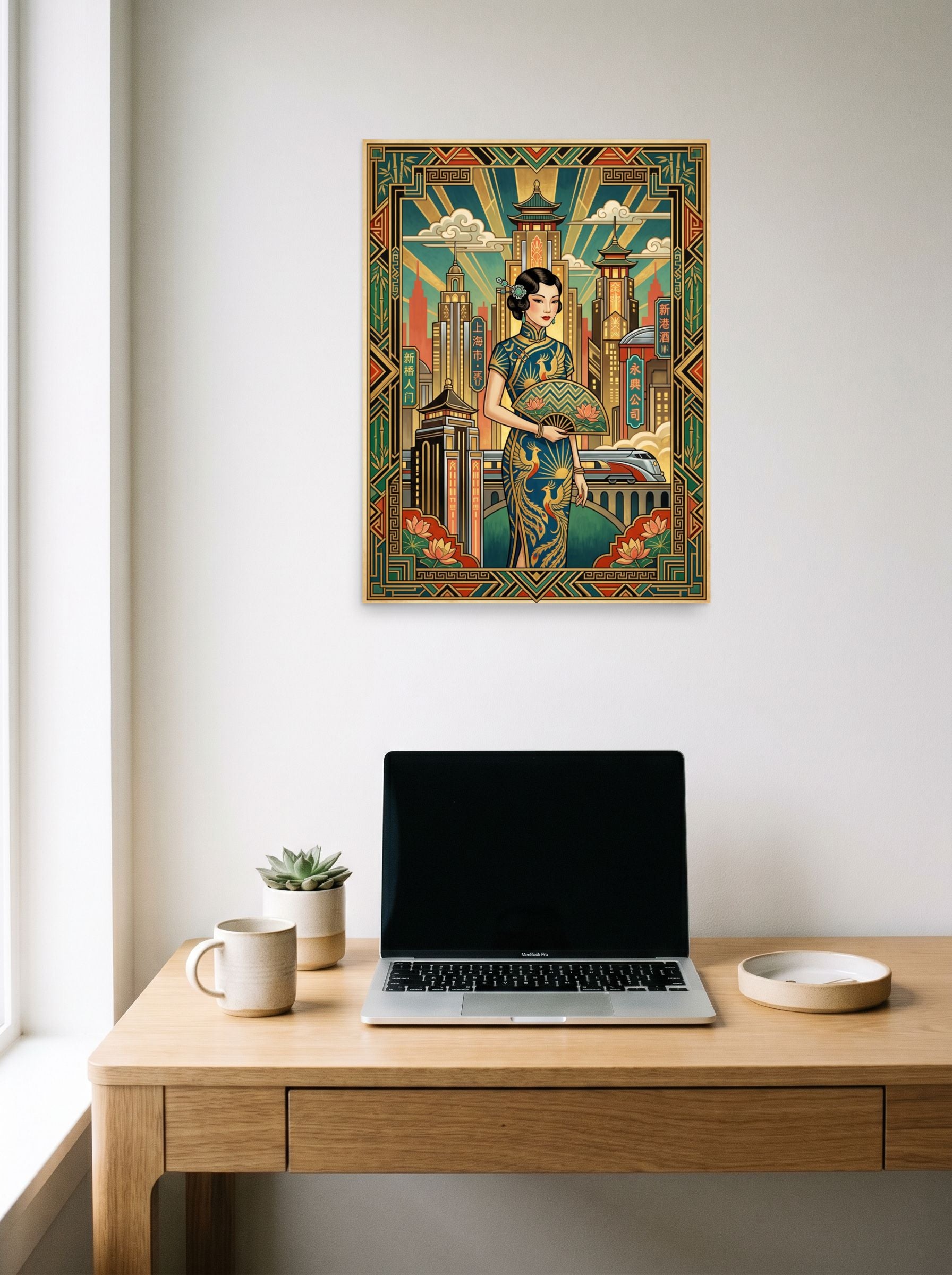 A 18x24 inch unframed paper Art Deco print of 'Shanghai Moderne' hanging above a worktable with a laptop.