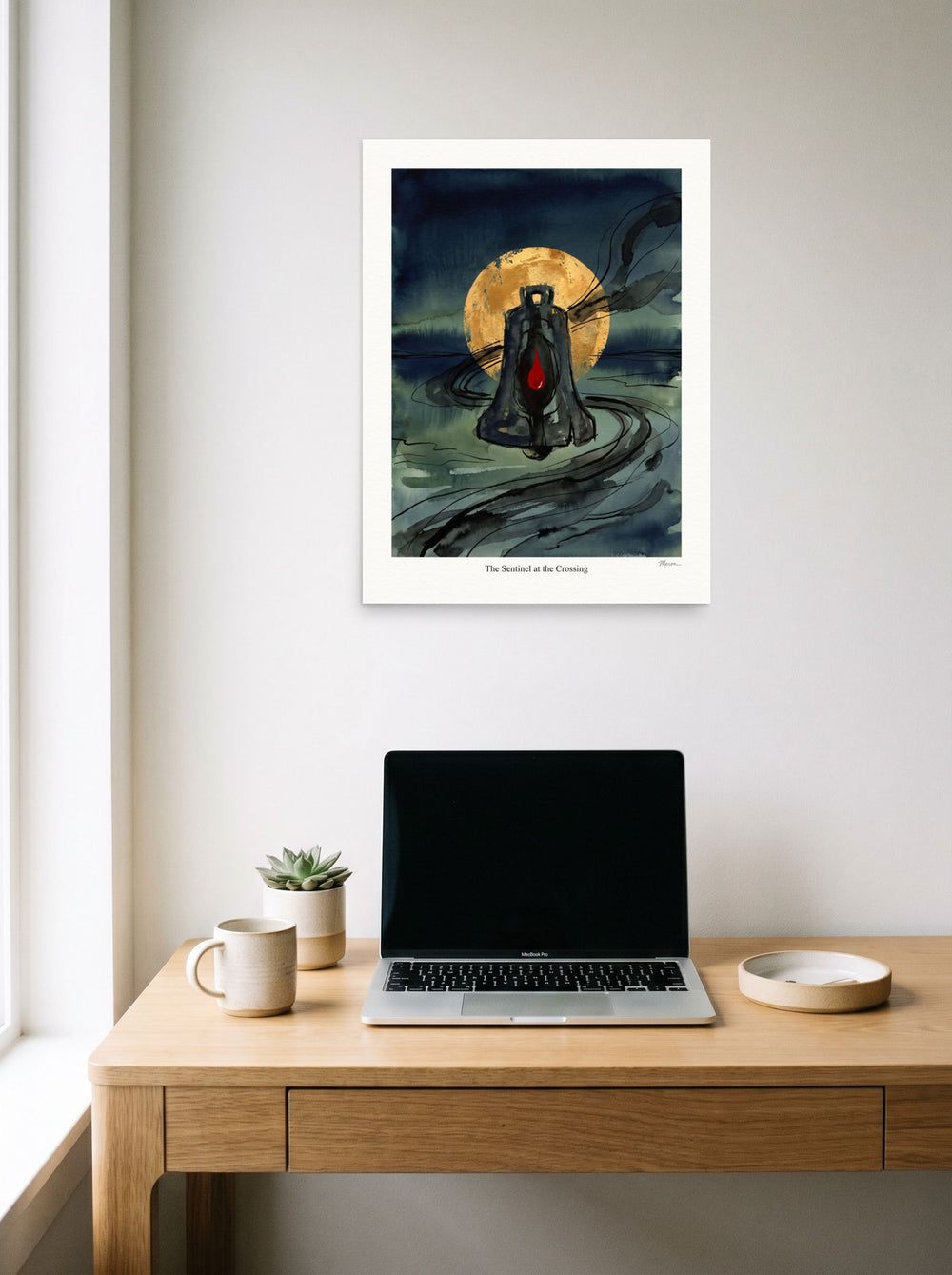 'The Sentinel at the Crossing' styled above a home-office workspace. A 18x24 inch unframed paper Symbolism print.