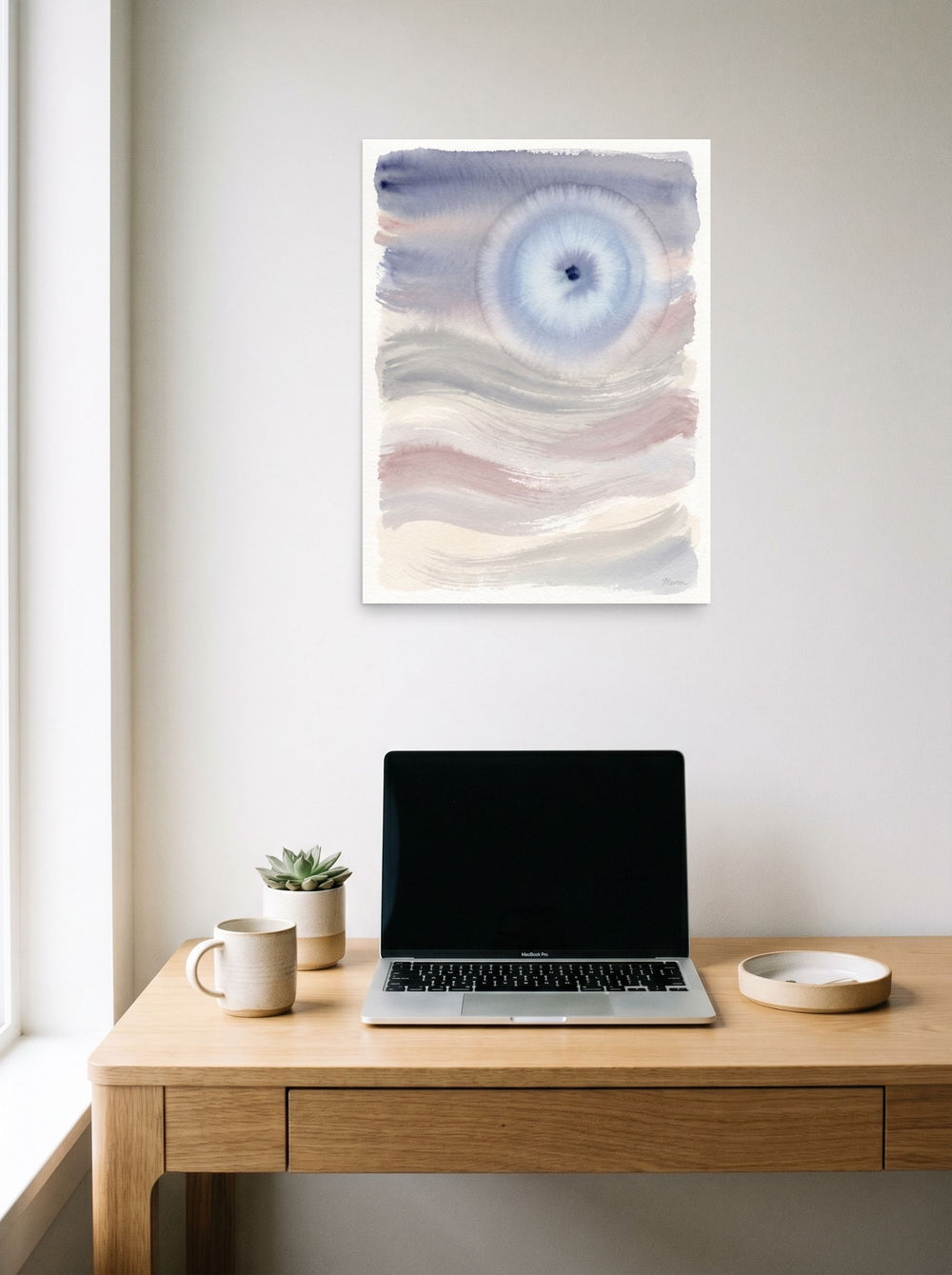 unframed paper wall art 'Periwinkle Halo' hanging above a worktable with a laptop, at 18x24 inch.
