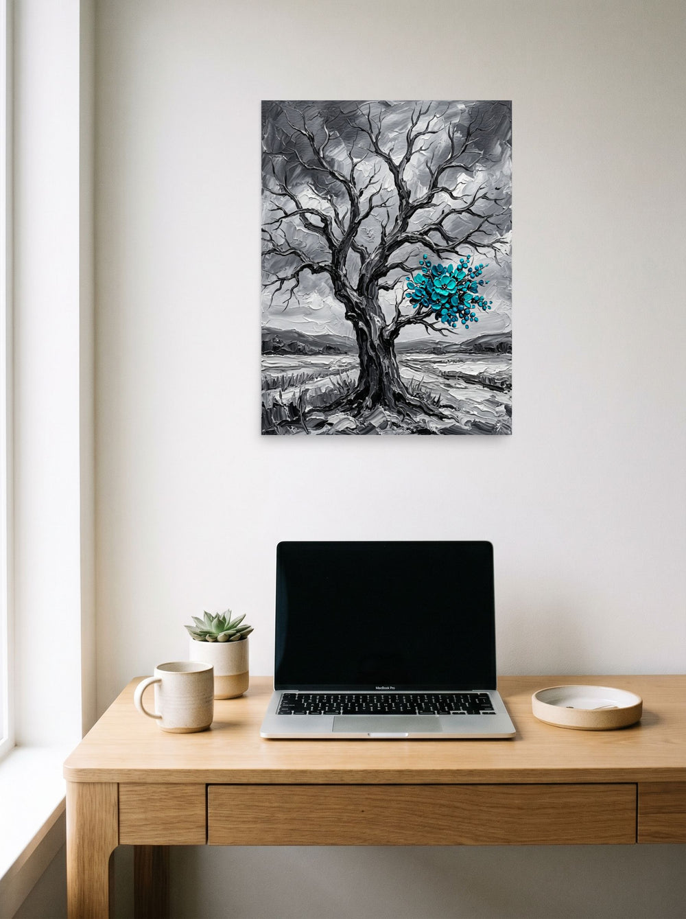 A 18x24 inch unframed paper Surrealism print of 'Winter's Bloom' hanging above a worktable with a laptop.