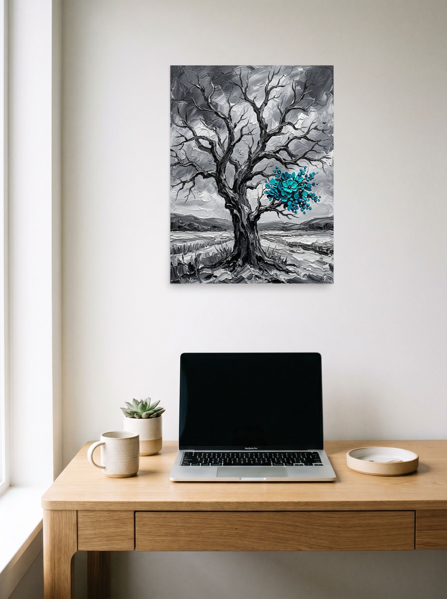 A 18x24 inch unframed paper Surrealism print of 'Winter's Bloom' hanging above a worktable with a laptop.