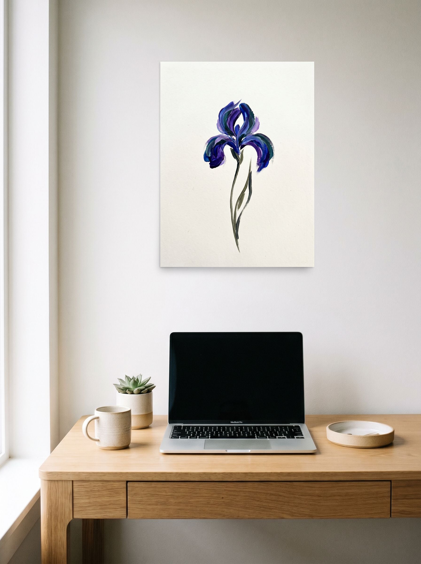A 18x24 inch unframed paper Minimalism,Impressionism print of 'Violet Impressions' hanging above a worktable with a laptop.