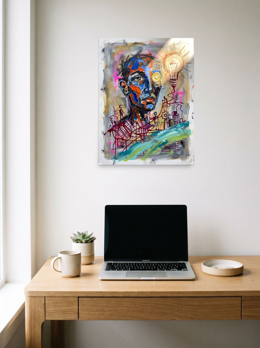 See 'Spark of Consciousness' as a unframed paper print (18x24 inch), hanging above a worktable with a laptop.