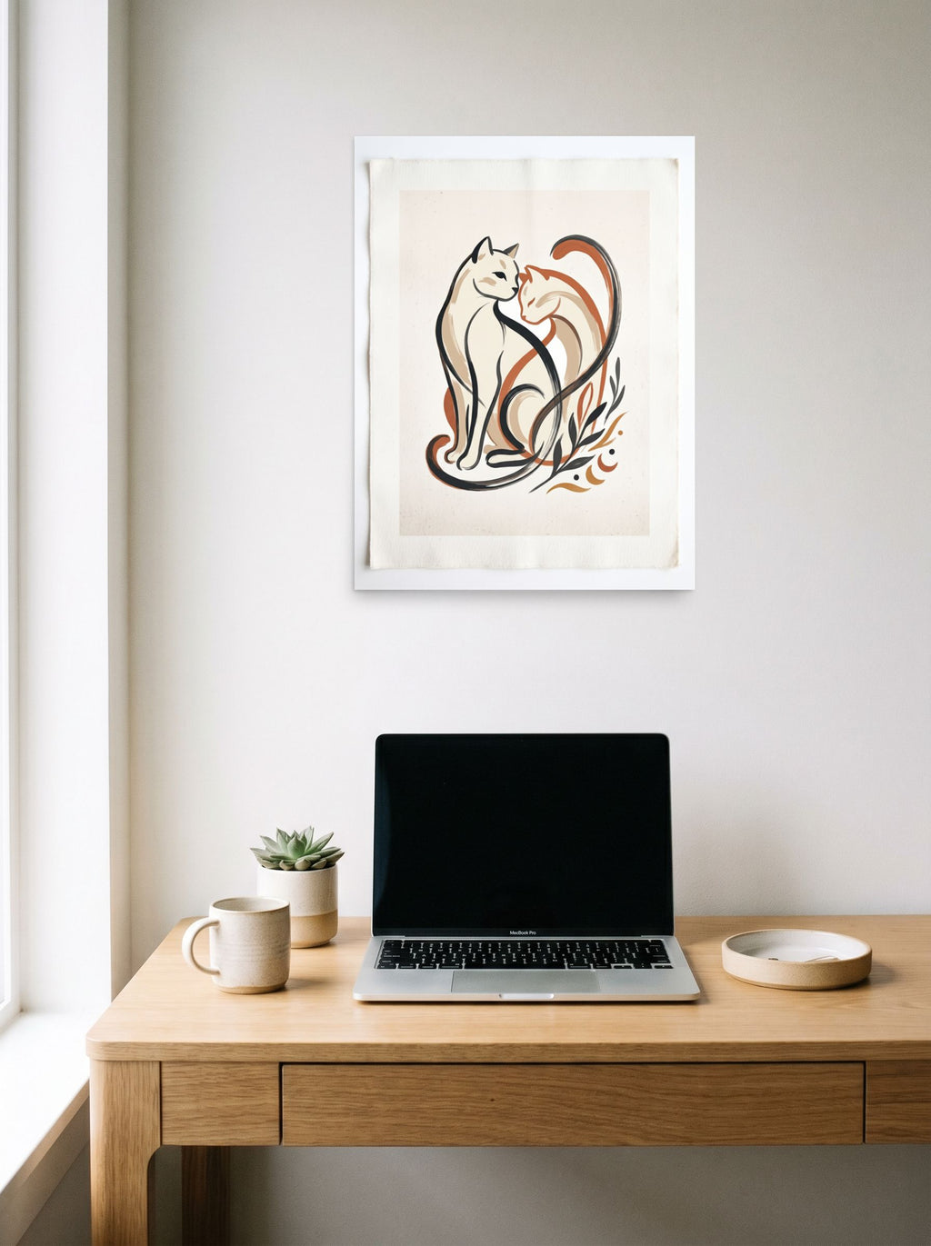 A 18x24 inch unframed paper Minimalism,Abstract art print of 'Feline Affection' hanging above a worktable with a laptop.