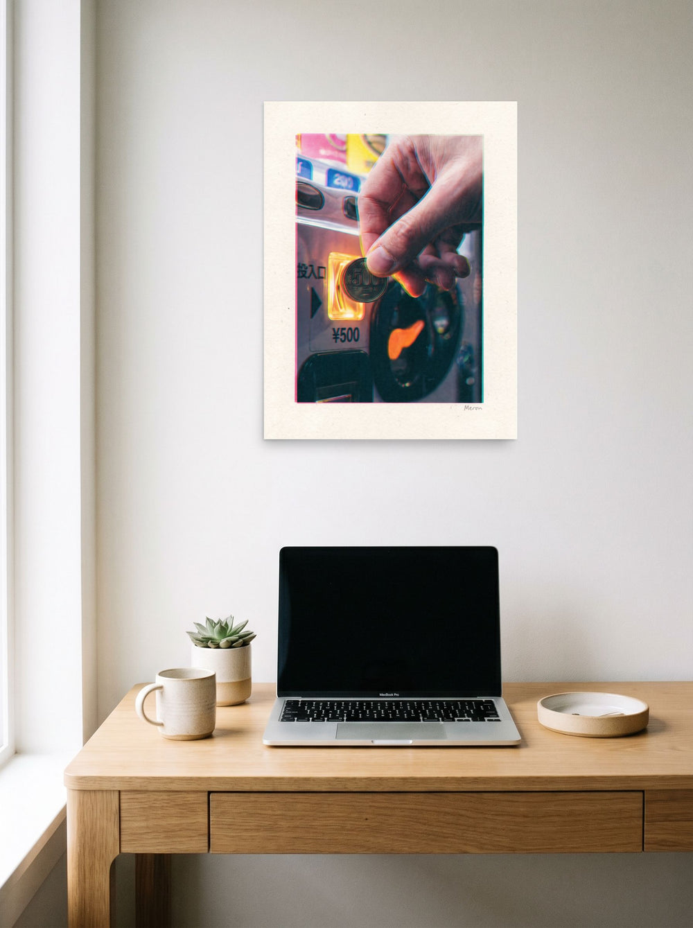 A 18x24 inch unframed paper version of 'Insert Coin', Digital art wall art, displayed over a compact desk setup.